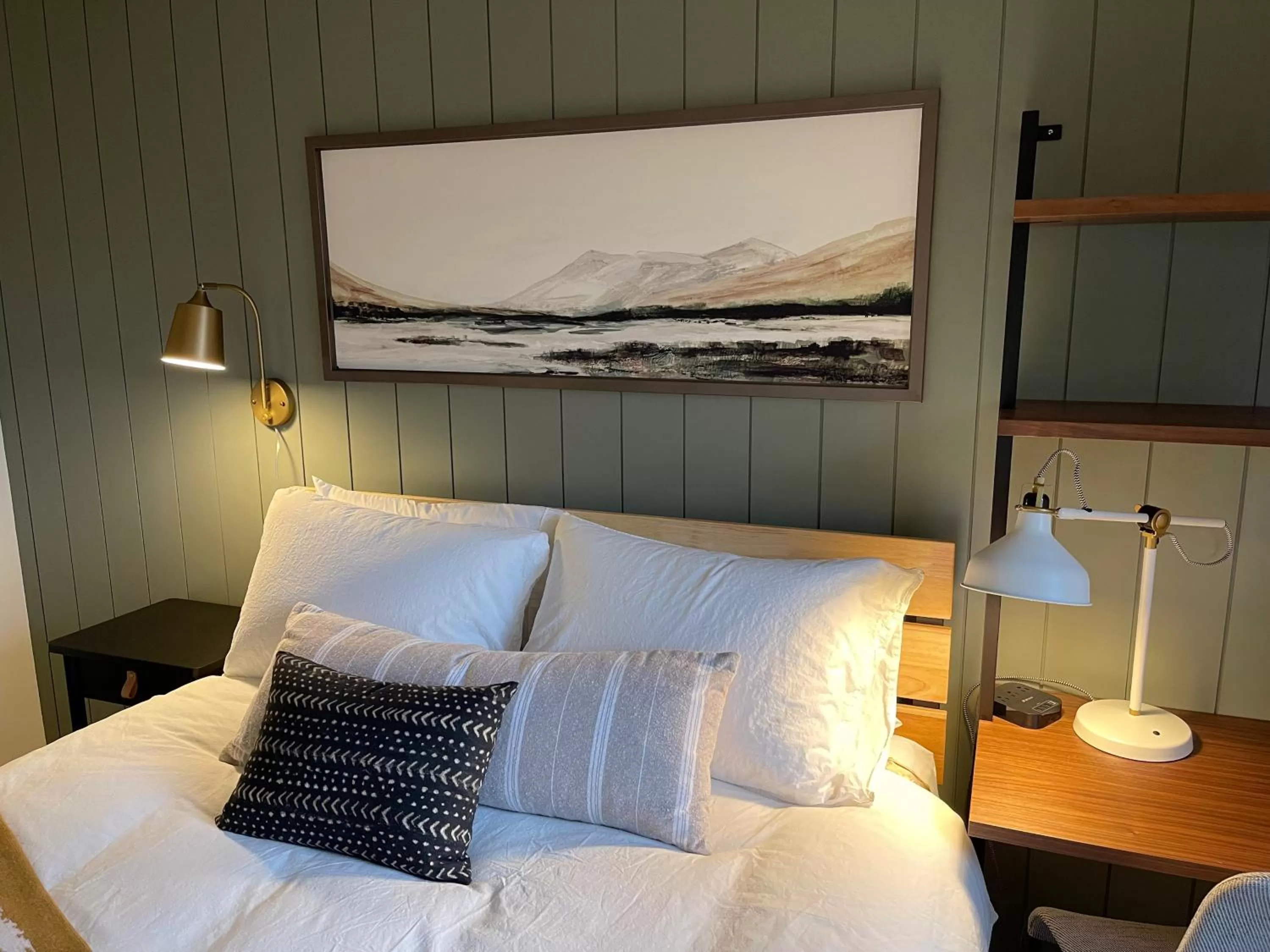 Bed in Pinedale Cozy Cabins