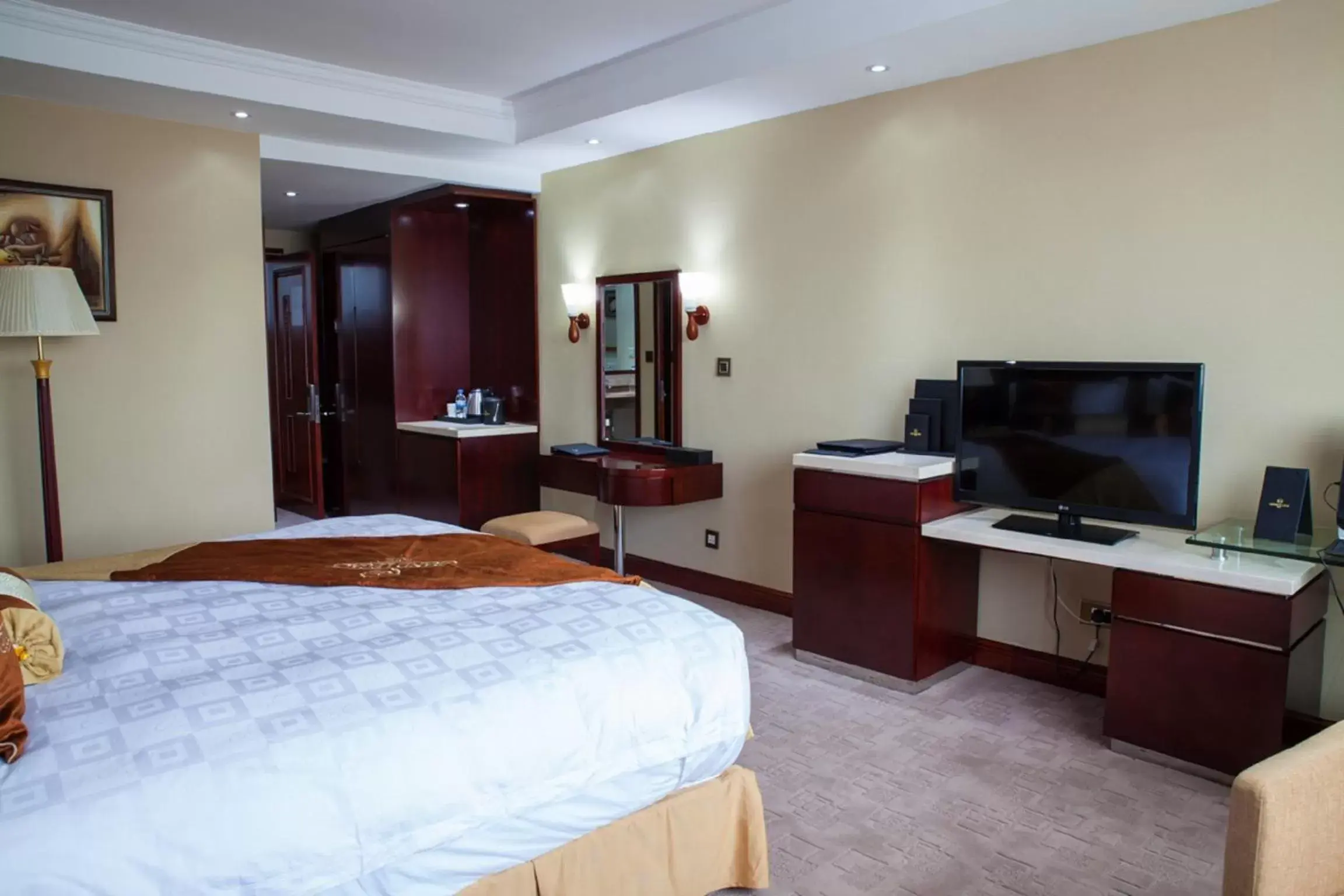 Bedroom, TV/Entertainment Center in Grand Legacy Hotel