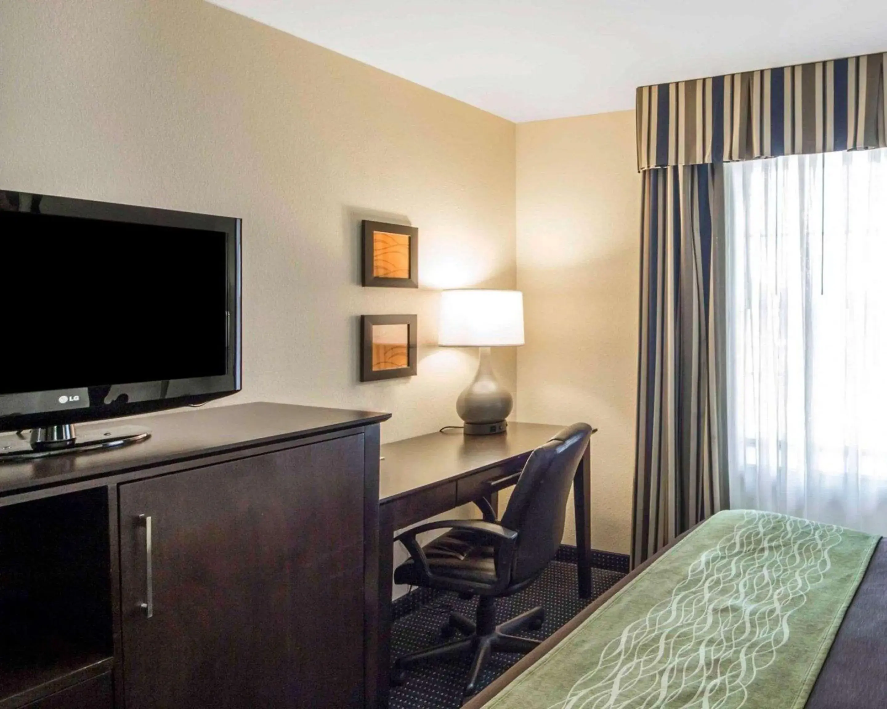 Photo of the whole room, TV/Entertainment Center in Quality Inn Tulsa-Downtown West