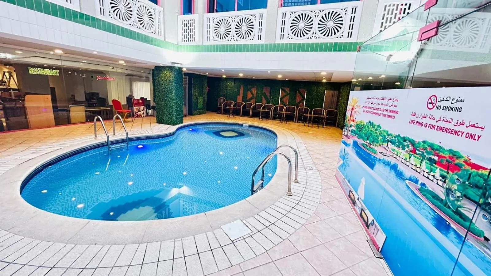 Swimming pool in Queens Hotel Next Sabkha Bus Station