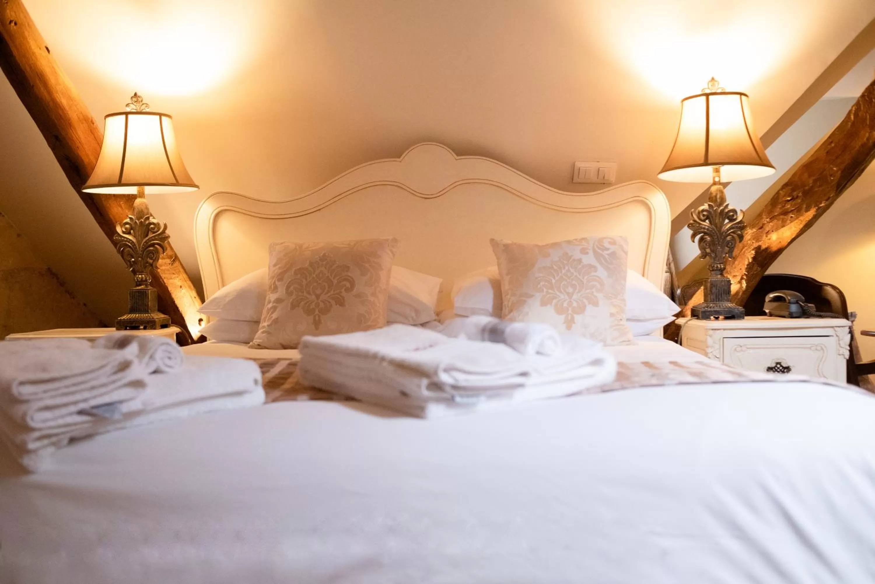 Bed in Logis Hotel De France