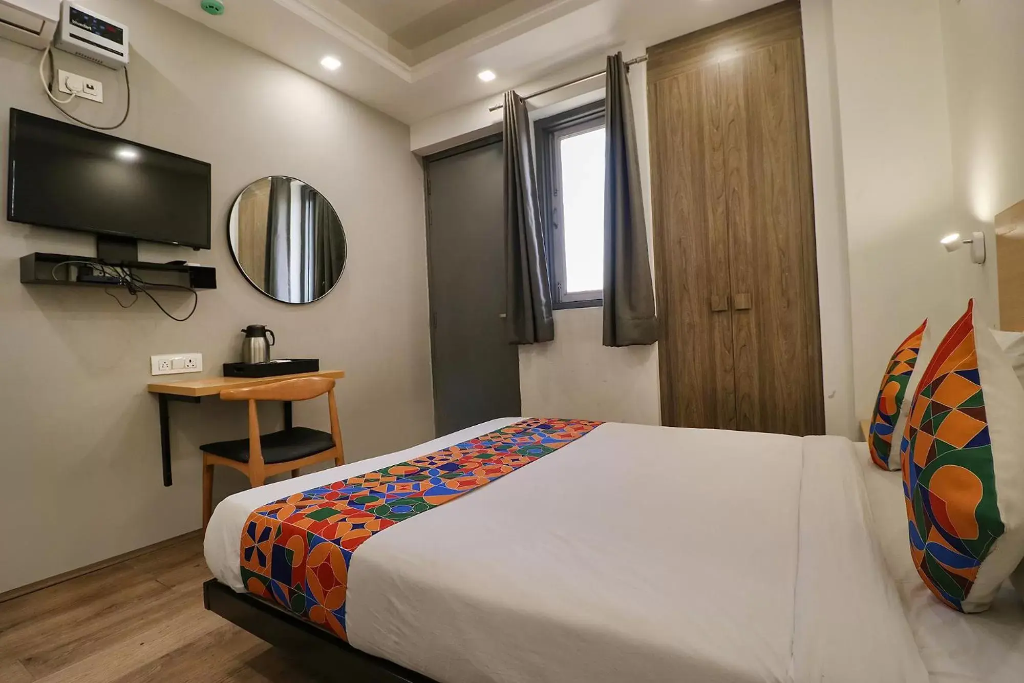 Communal lounge/ TV room, Bed in FabHotel The Chaitanyas Rohini sec 18 Communal lounge/ TV room, Bed in FabHotel The Chaitanyas Rohini sec 18