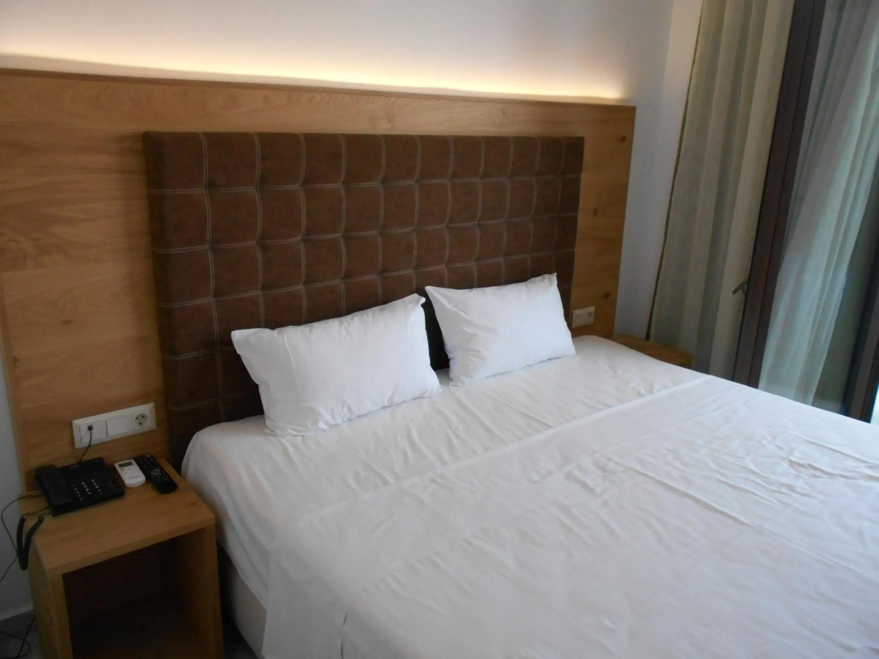 Bed in Artemis Hotel Apartments