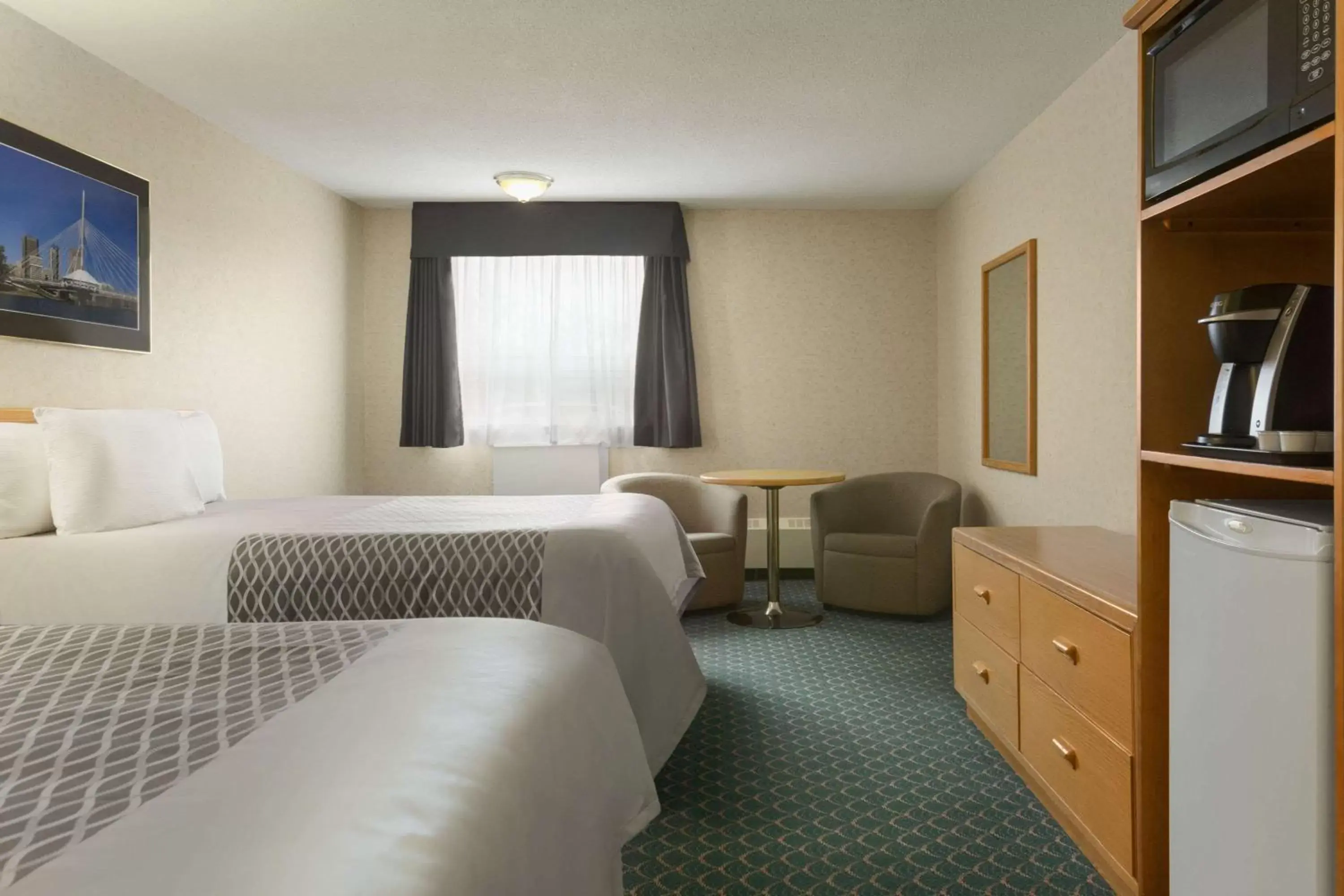 Photo of the whole room, Bed in Travelodge by Wyndham Winnipeg East