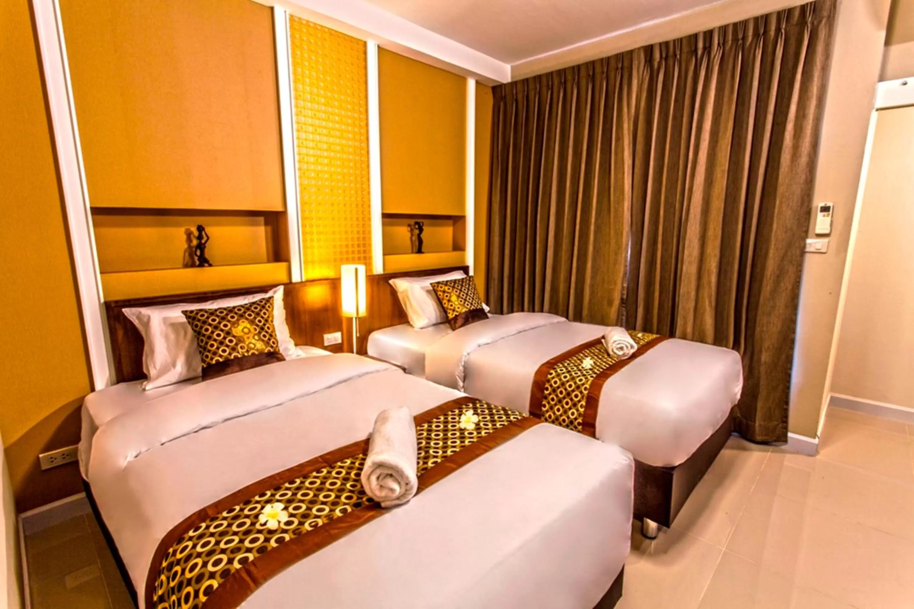 Photo of the whole room, Bed in The Aim Sathorn Hotel