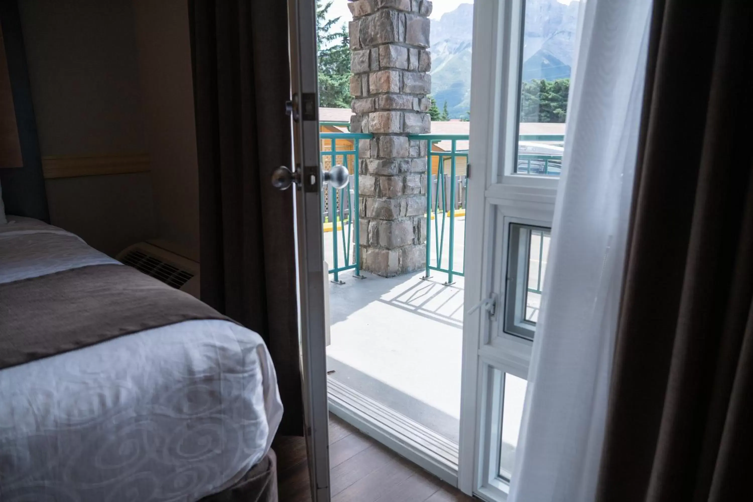 Balcony/Terrace, Bed in Pocaterra Inn & Waterslide Balcony/Terrace, Bed in Pocaterra Inn & Waterslide