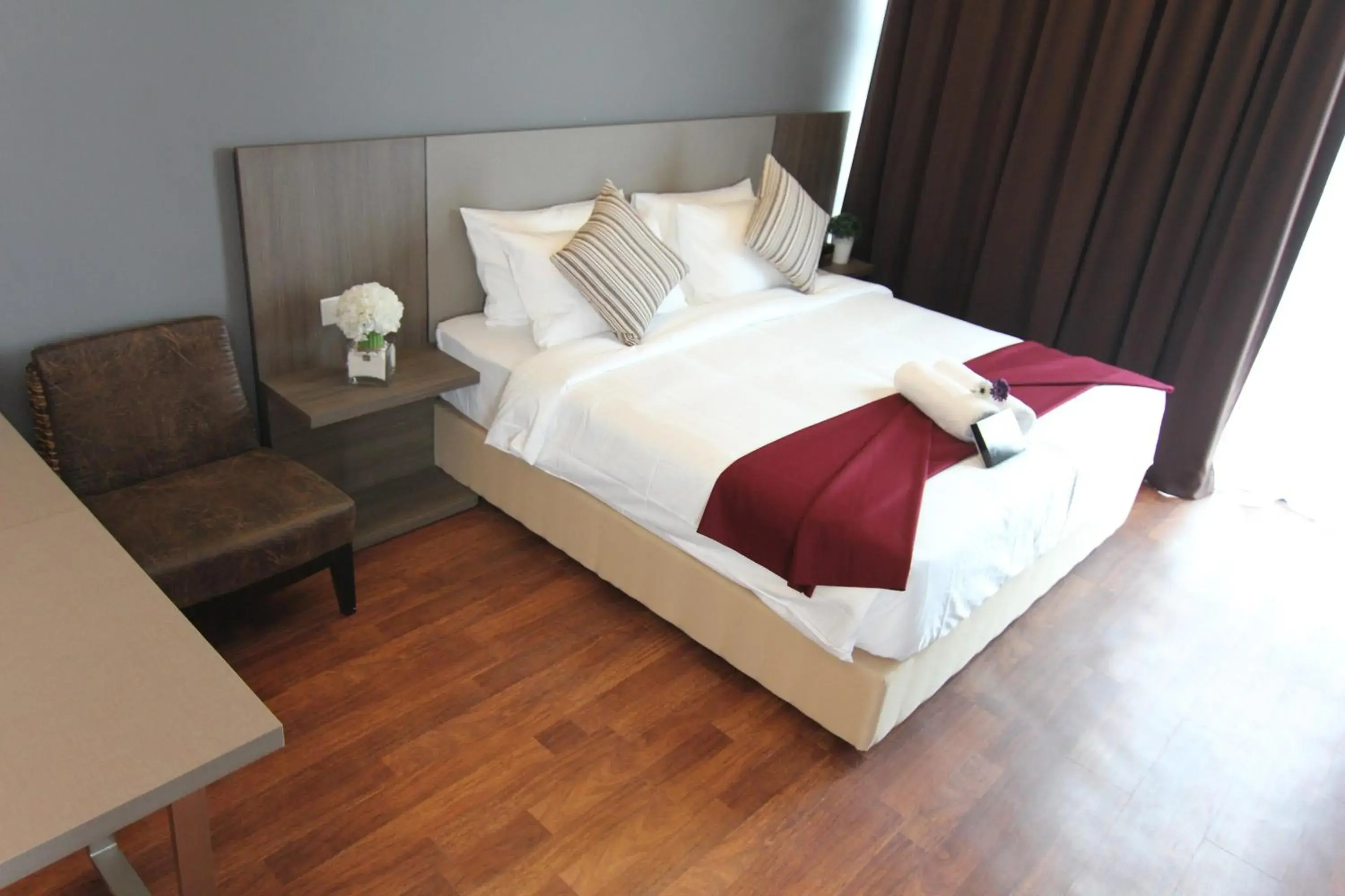 Bed in Nexus Business Suite Hotel