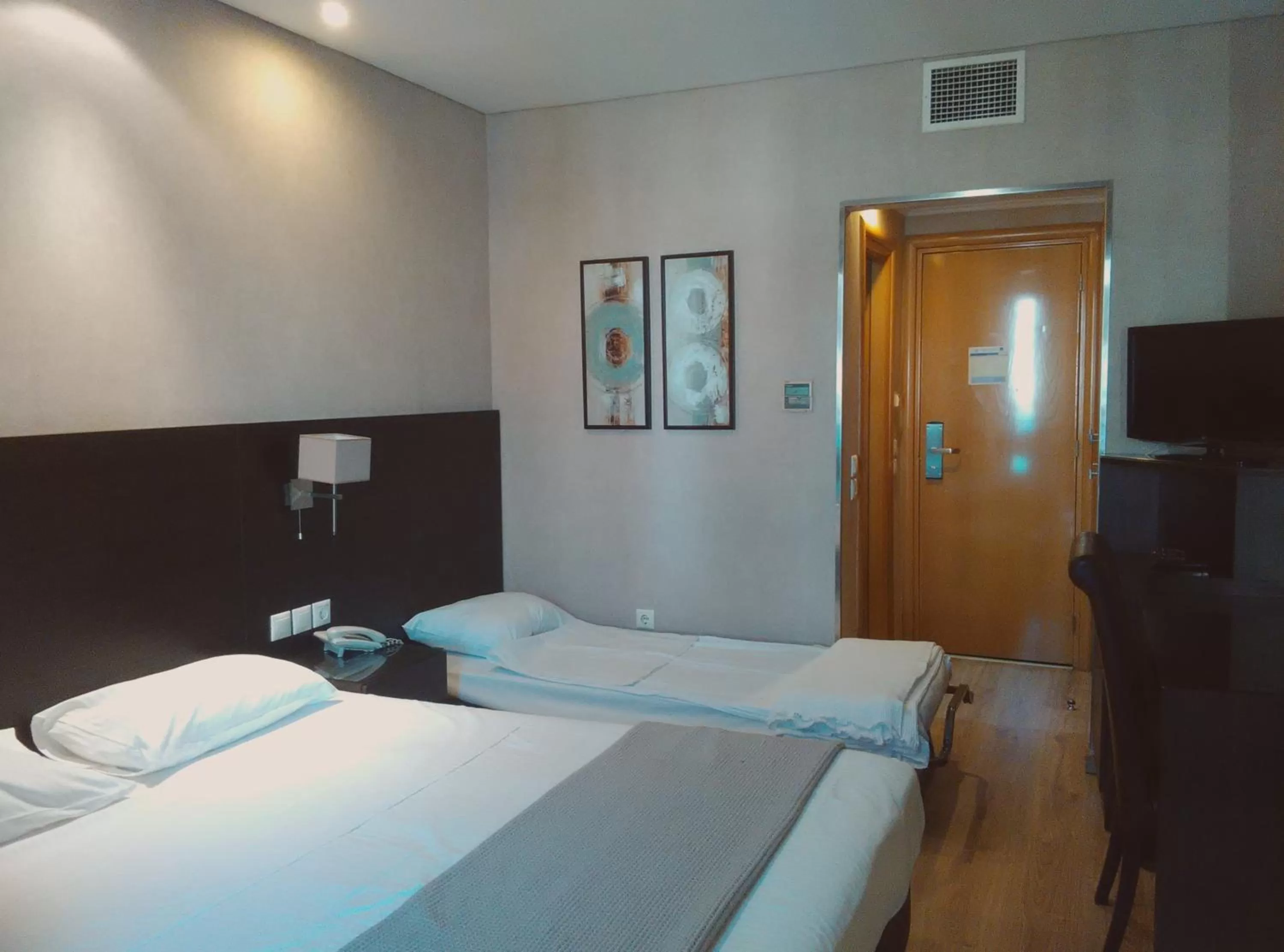 Bed in Nefeli Hotel Alimos