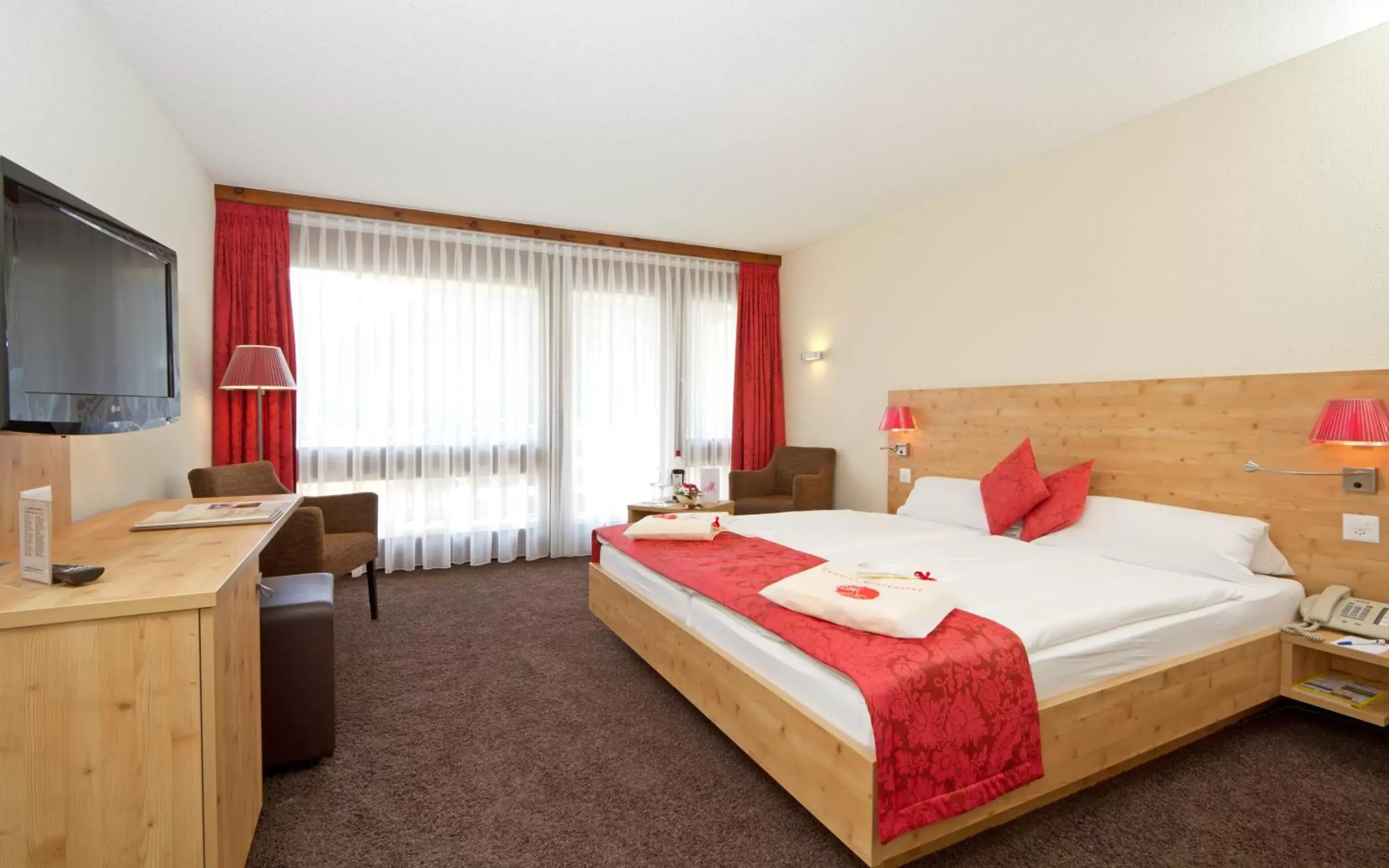 Photo of the whole room, Bed in Central Swiss Quality Sporthotel
