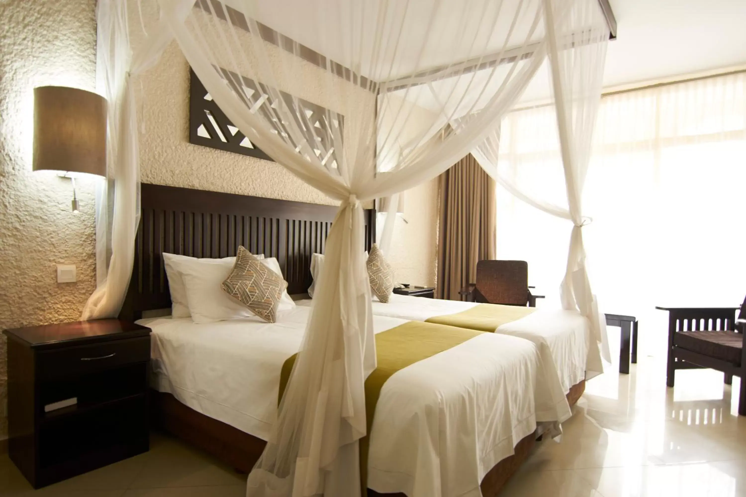 Bed in Victoria Falls Rainbow Hotel