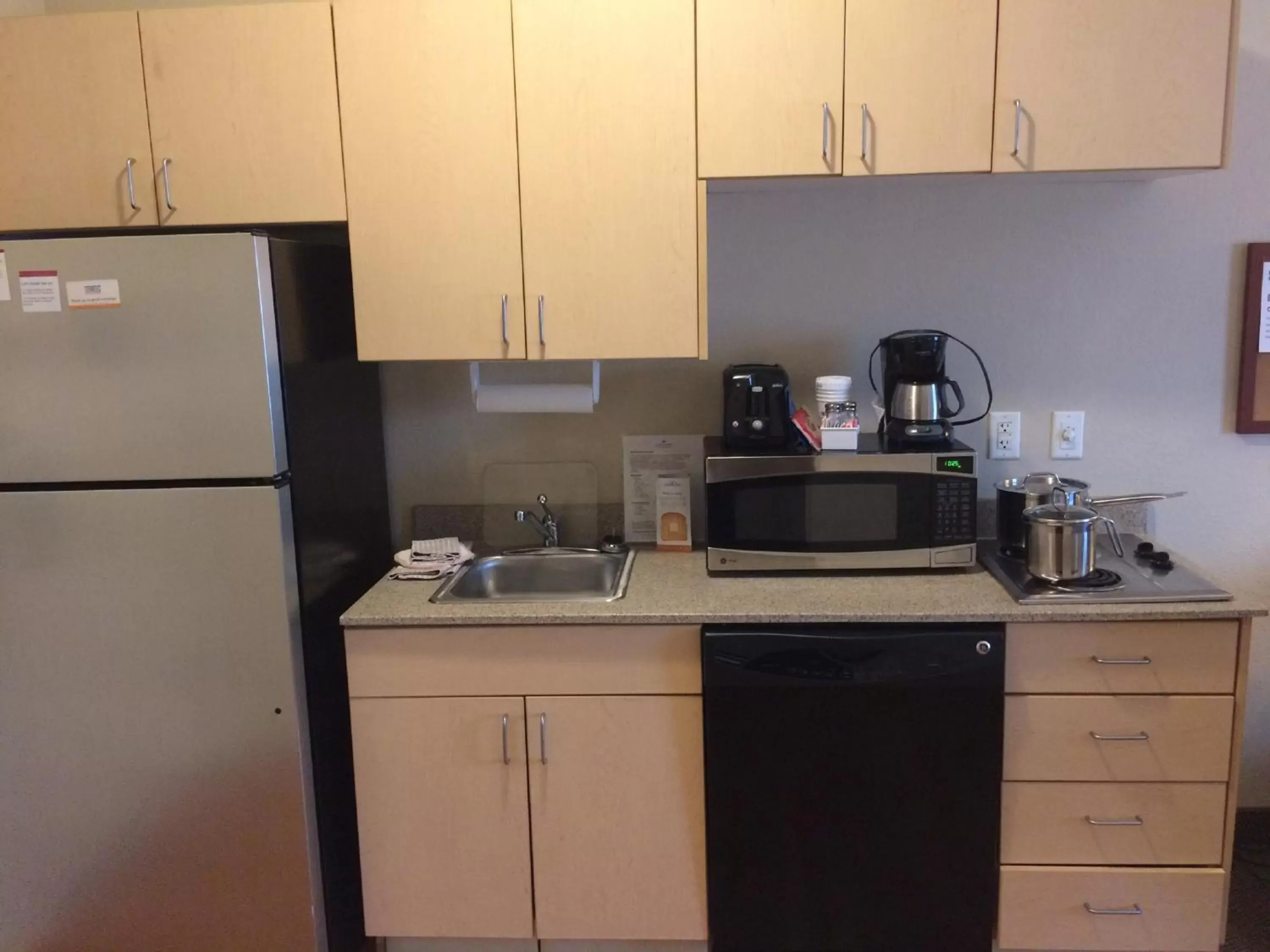 Photo of the whole room, Kitchen/Kitchenette in Candlewood Suites Watertown Fort Drum, an IHG Hotel