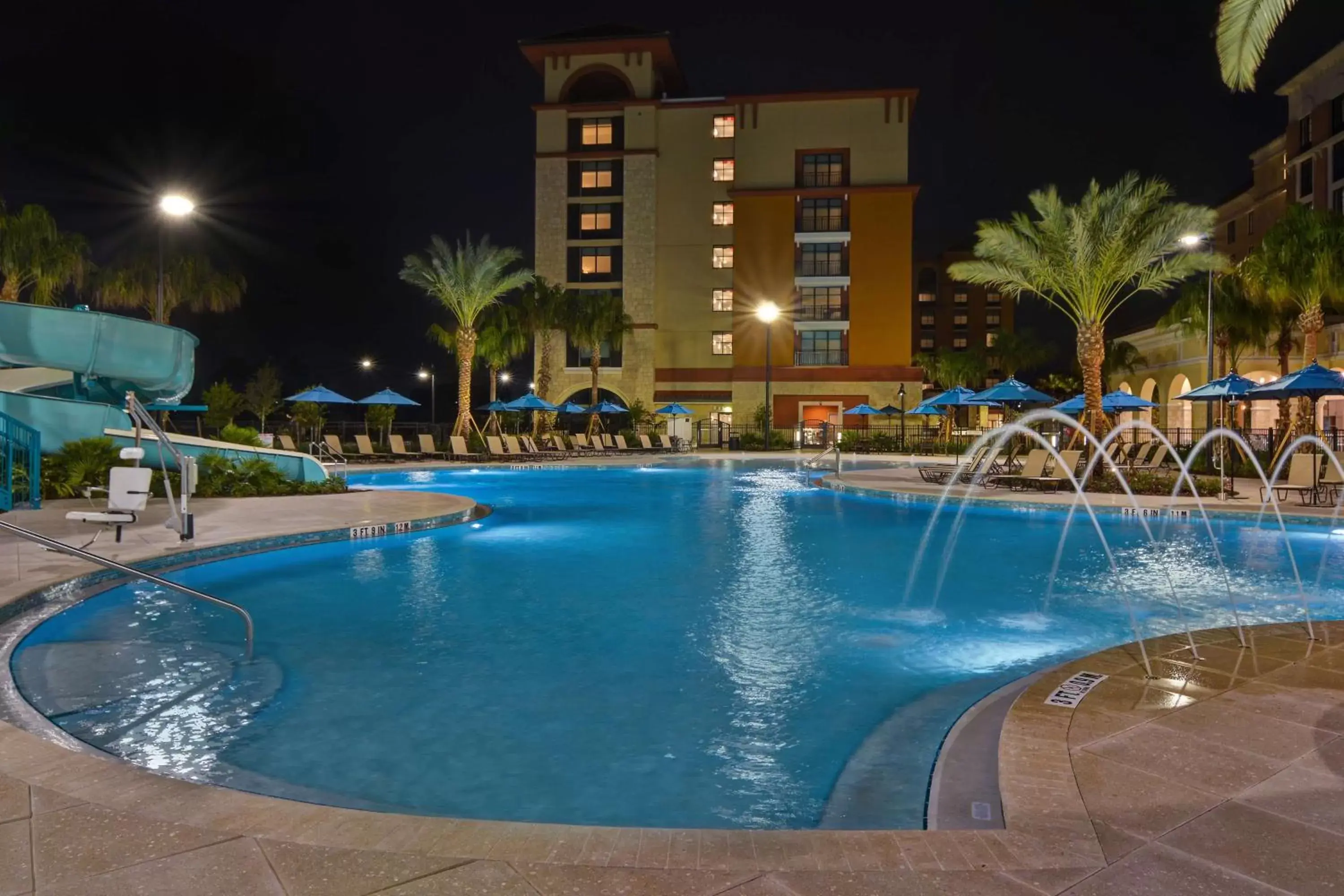Property building, Swimming Pool in Home2 Suites By Hilton Orlando Flamingo Crossings, FL