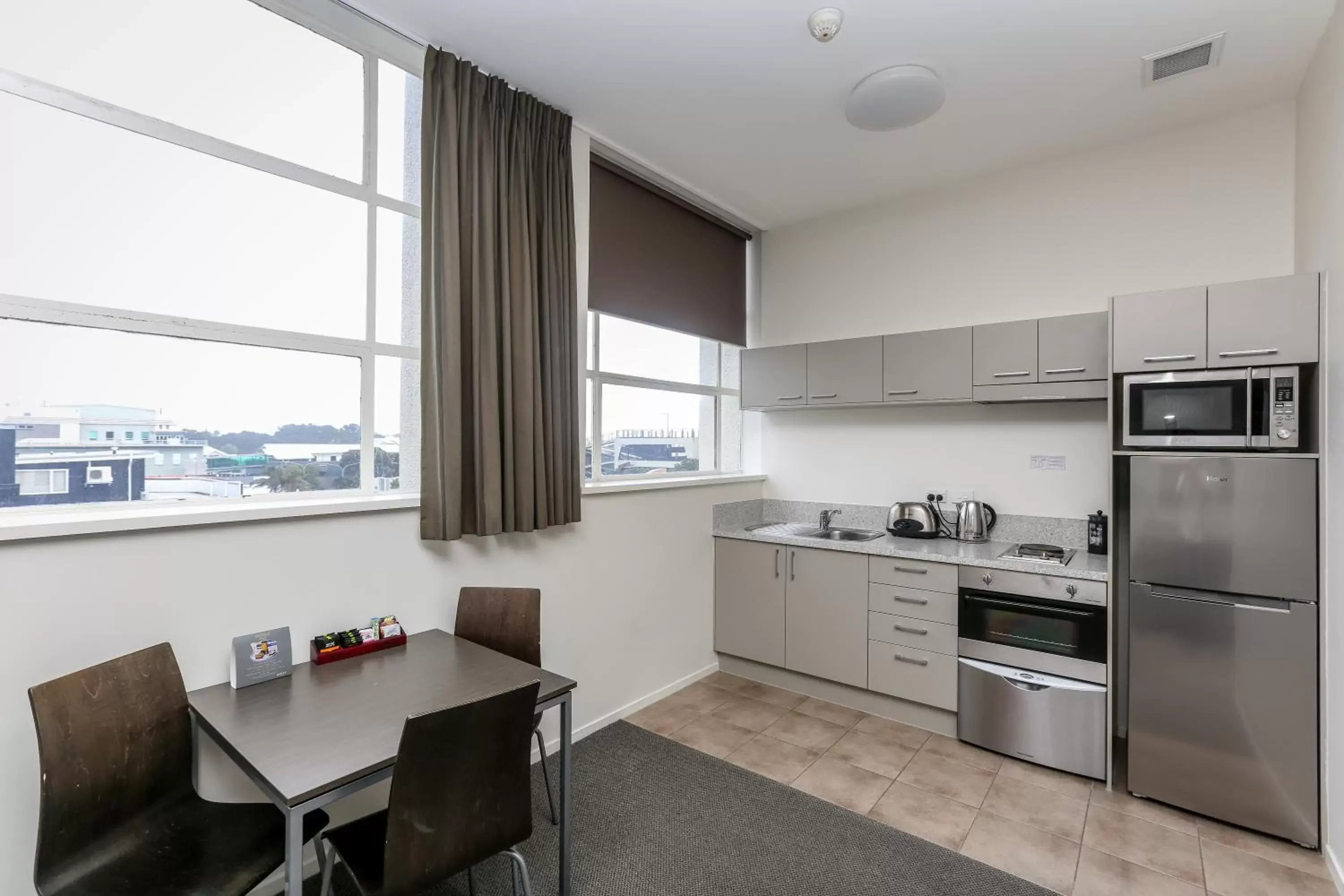 Dinner, Kitchen/Kitchenette in Quest New Plymouth Serviced Apartments