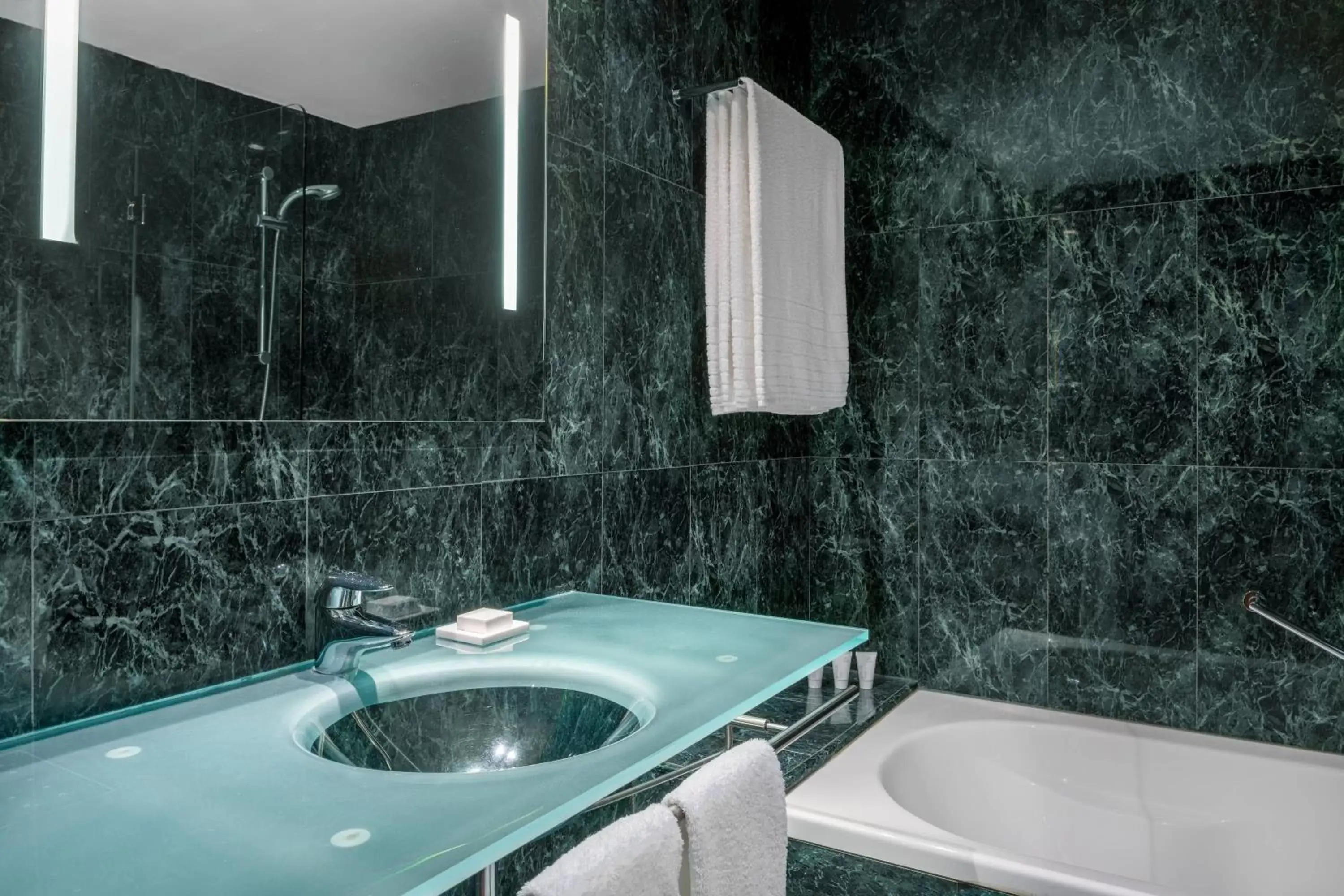 Bathroom in AC Hotel Huelva by Marriott
