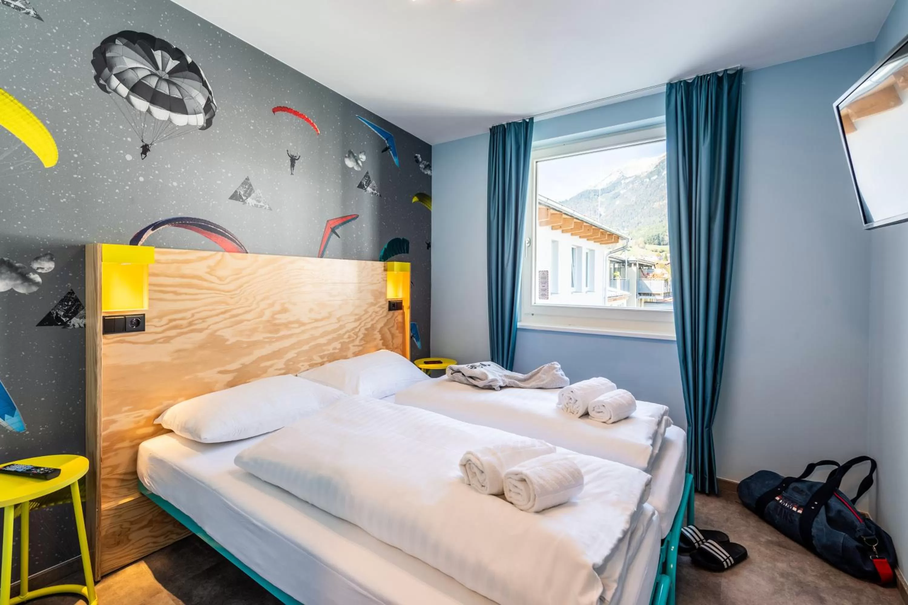 Photo of the whole room, Bed in MEININGER Hotel Innsbruck Zentrum