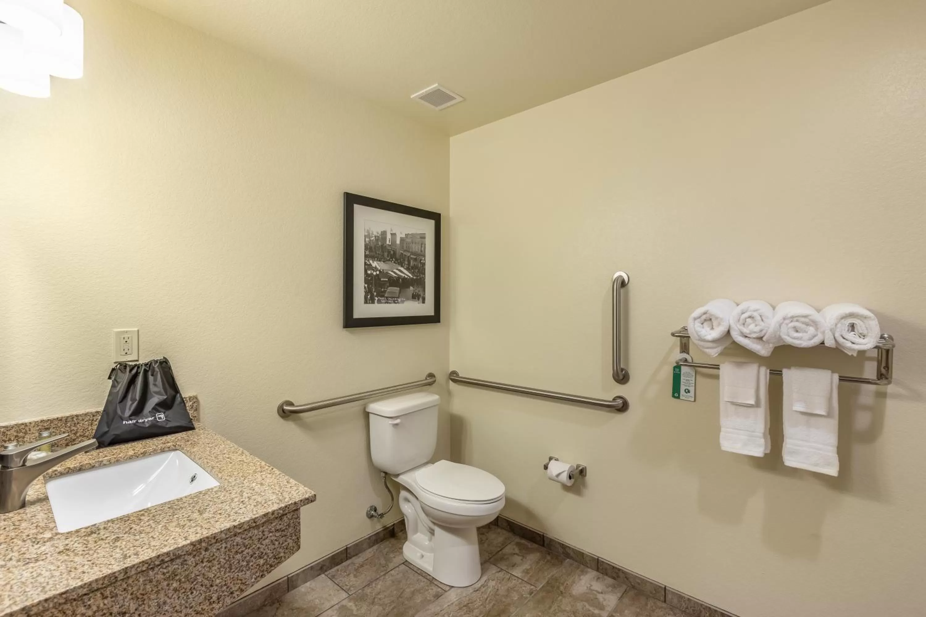 Toilet in Cobblestone Hotel & Suites - Stevens Point