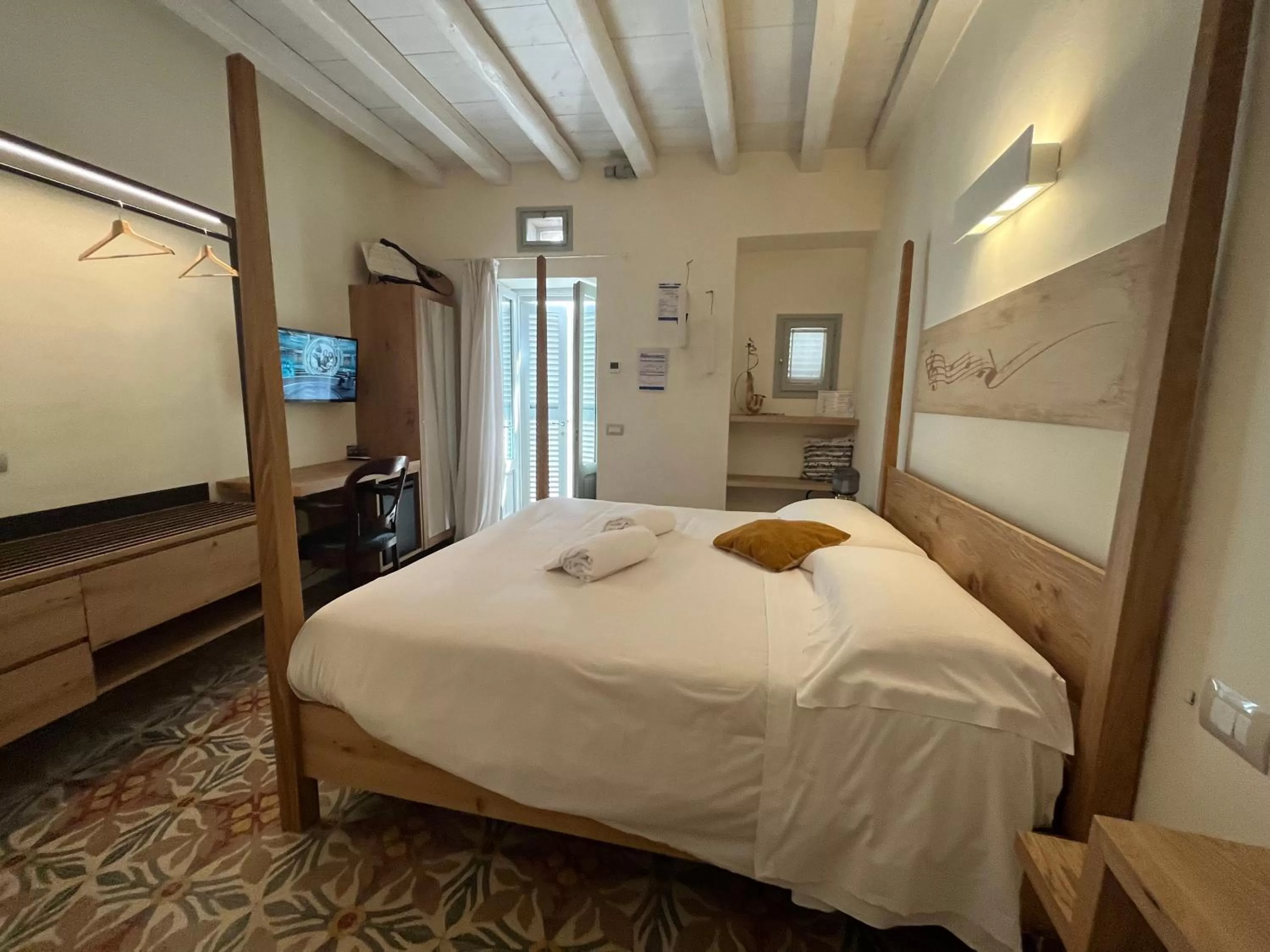 Bed in Antico Mondo Rooms & Suites