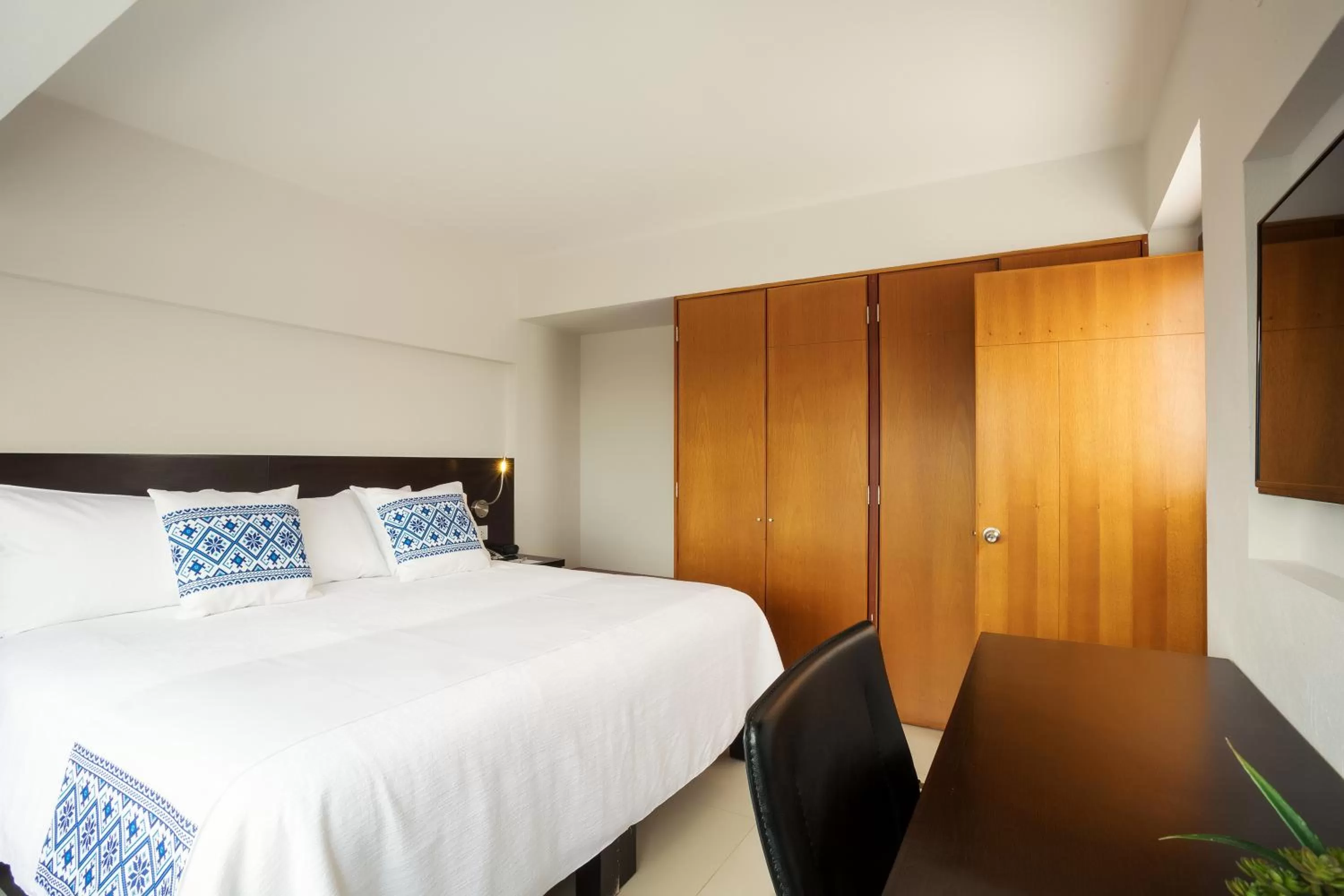 Bed in Hotel Indigo Guadalajara Expo by IHG