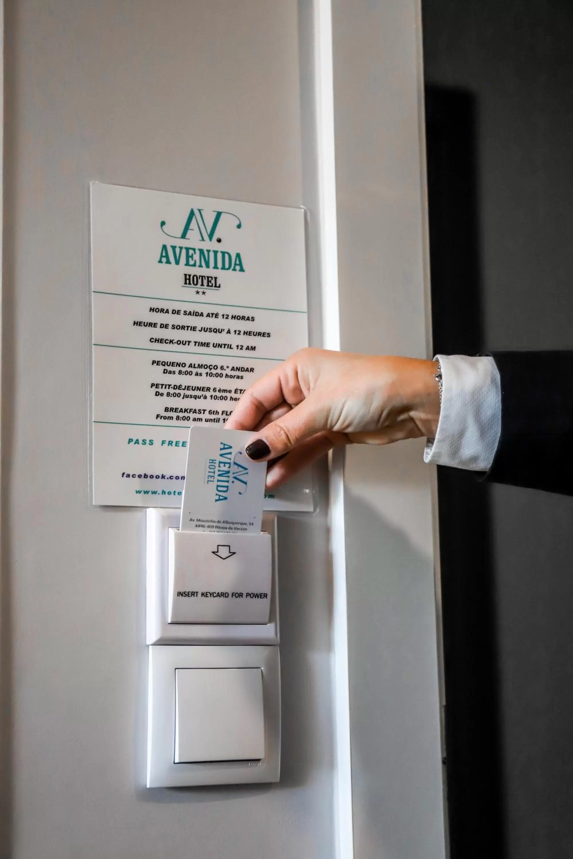 Property logo or sign in Hotel Avenida