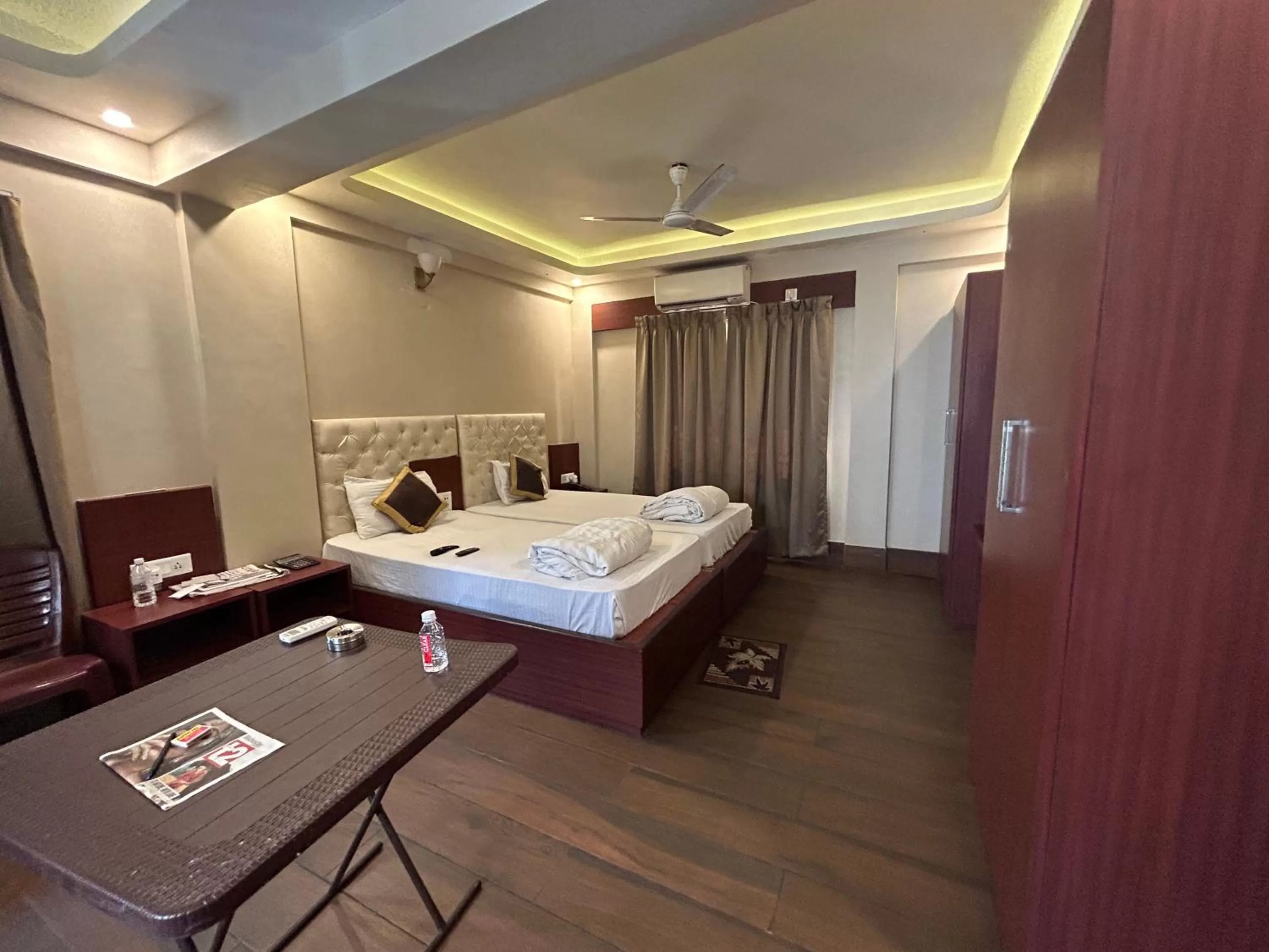 Bed in The Aster Enclave Hotel