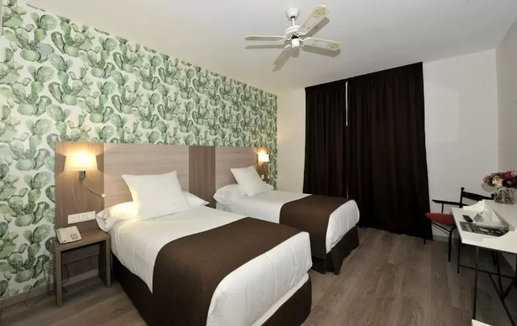 Bed in Hotel Salobreña Suites