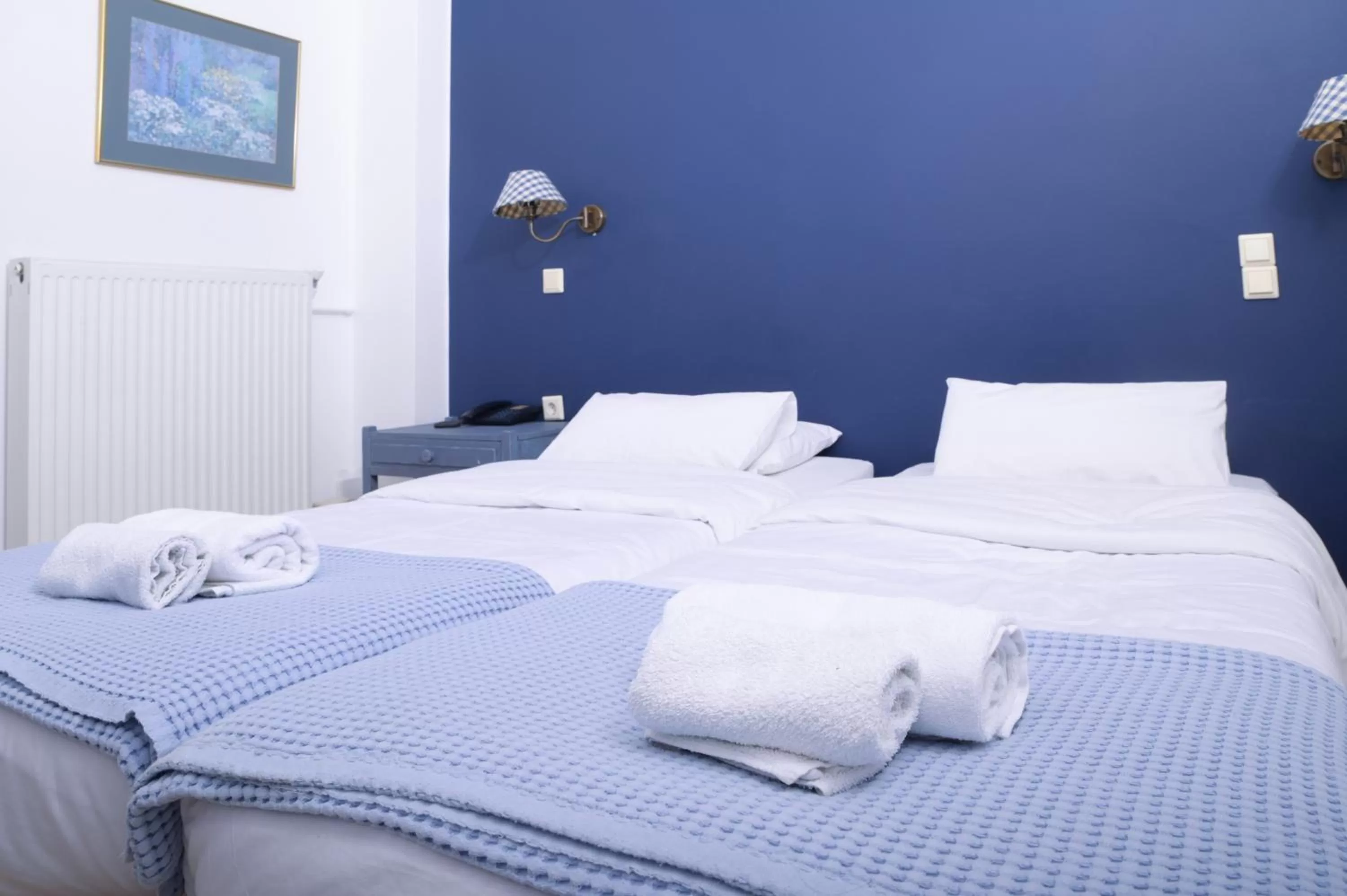 Bed in Ikaros Art Hotel