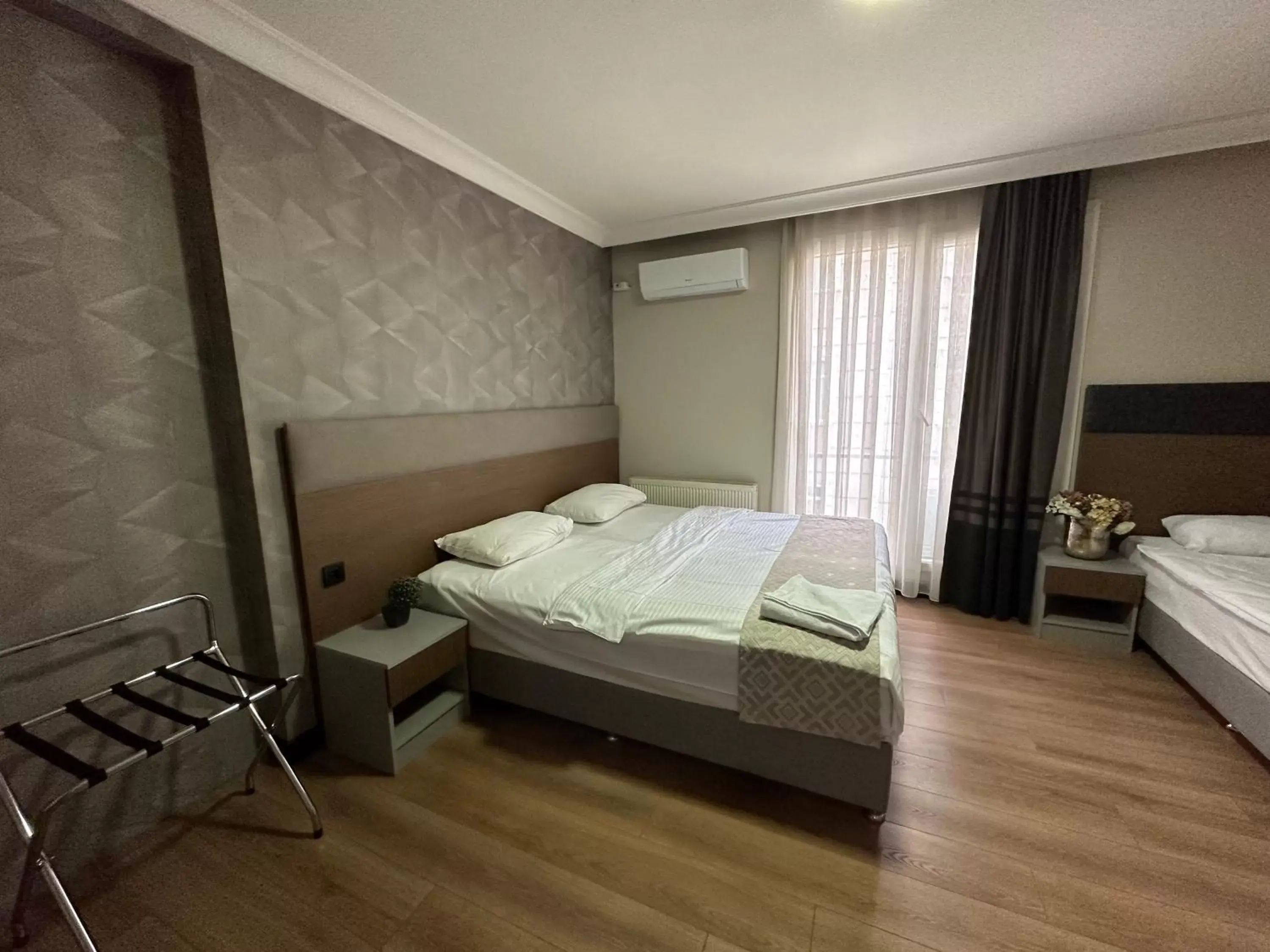 Bed in Niconya Port Suite&Hotel