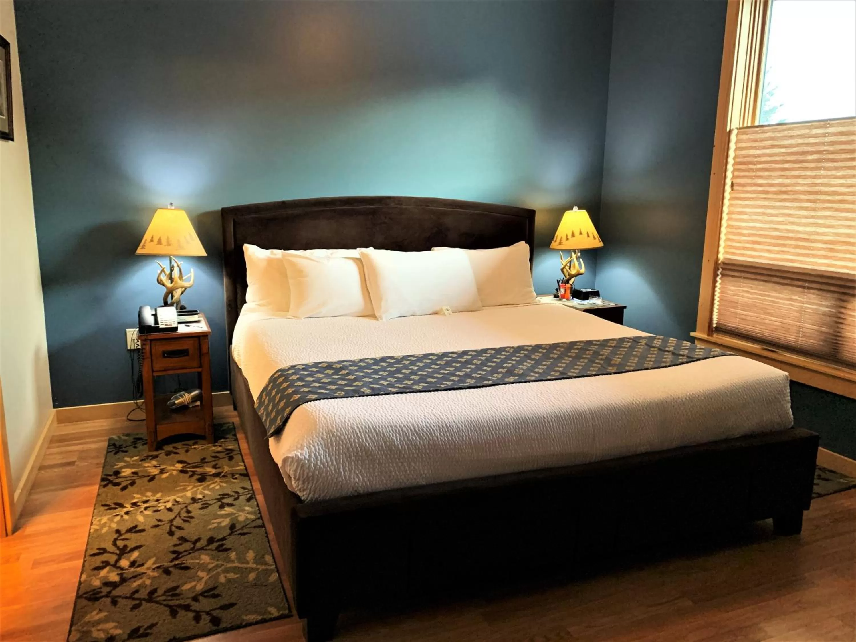 Bed in Twisp River Suites