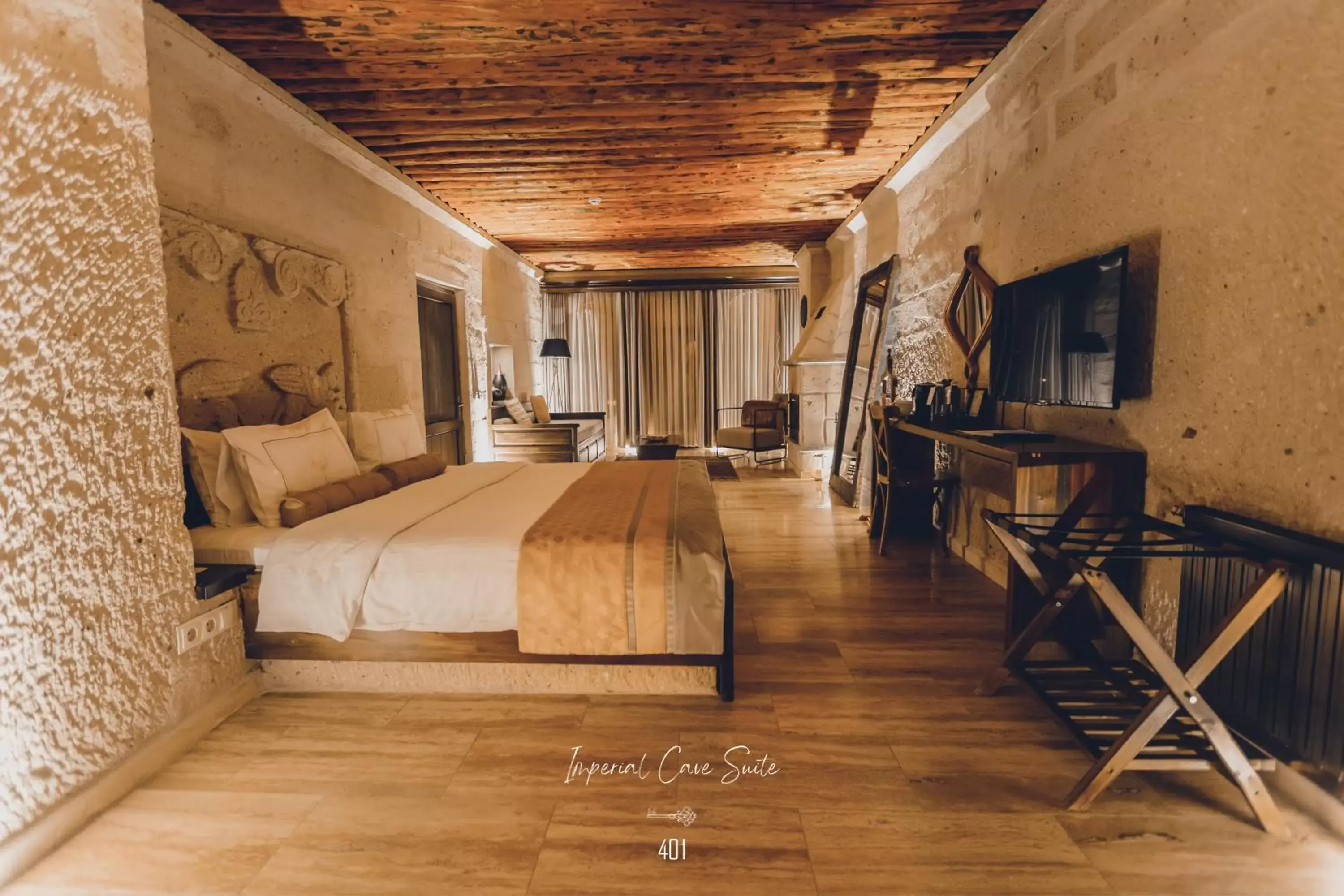 Bed, Seating Area in Nino Cave Suites