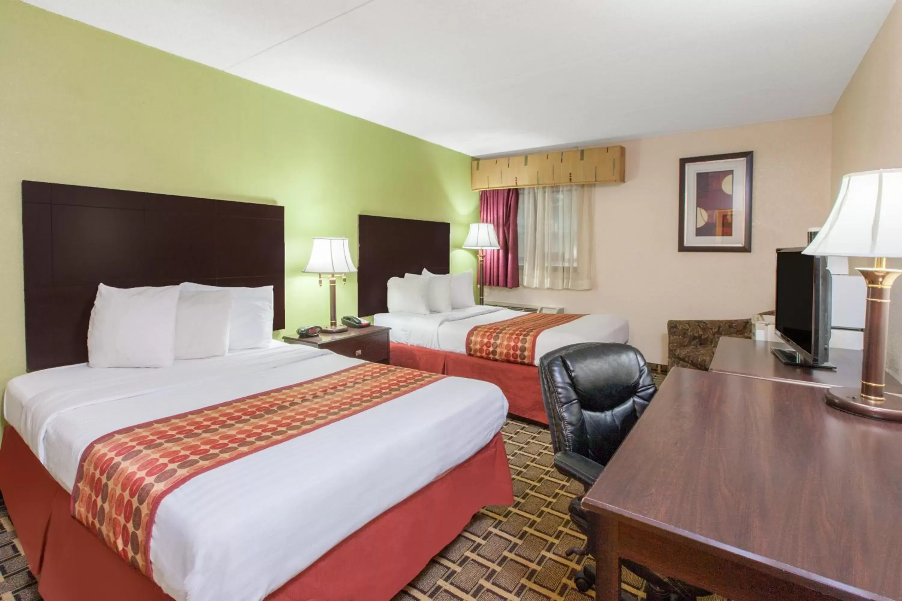TV and multimedia, Room Photo in Days Inn & Suites by Wyndham Madison Heights MI