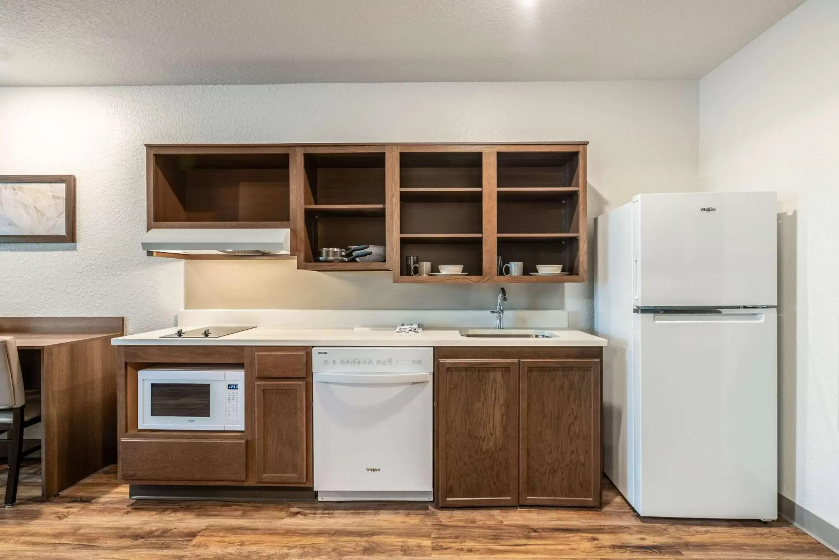 Photo of the whole room, Kitchen/Kitchenette in WoodSpring Suites Sanford North I-4 Orlando Area