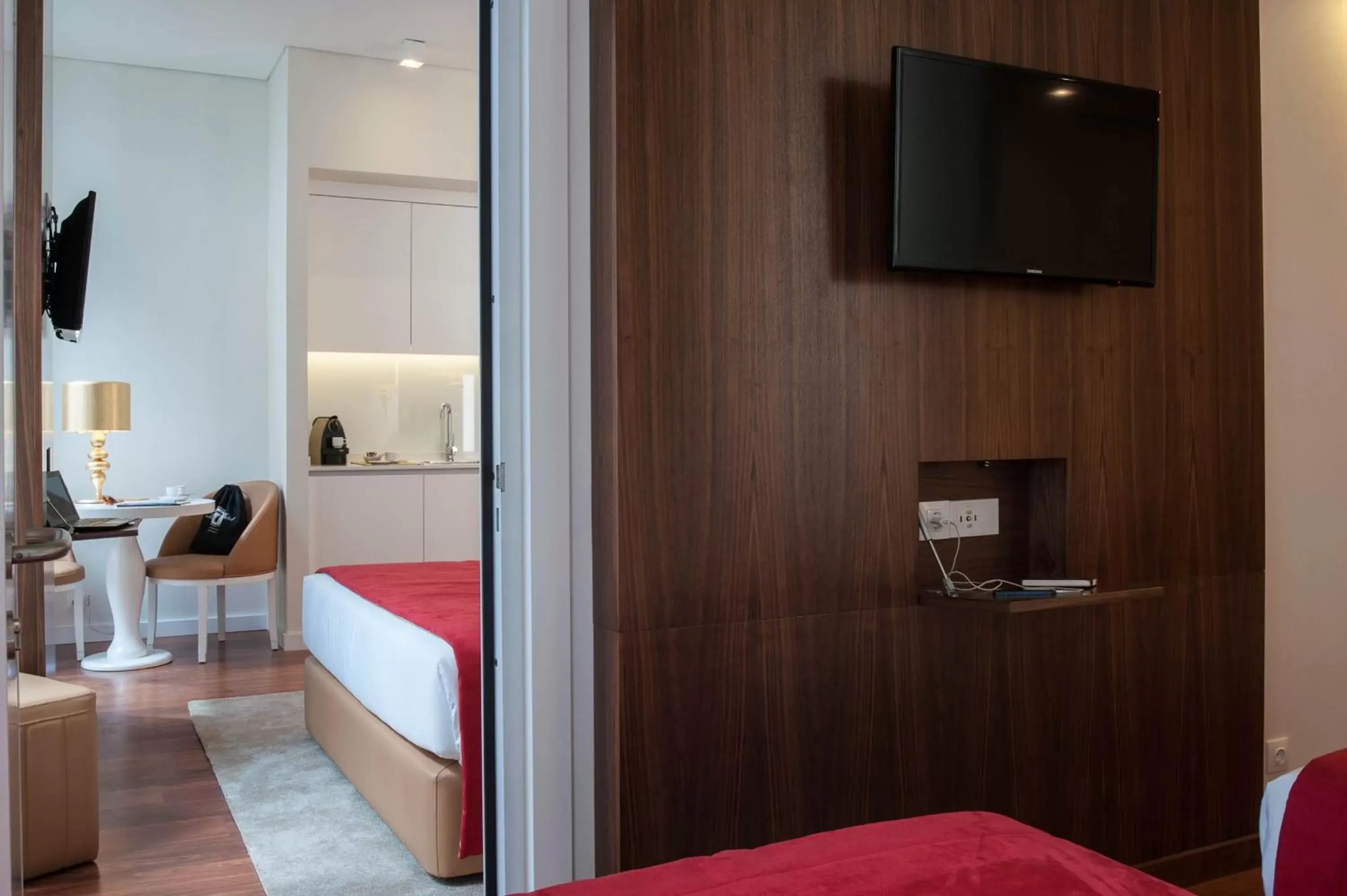 Bedroom, TV/Entertainment Center in The 7 Hotel, Suites, Studios & Apartments