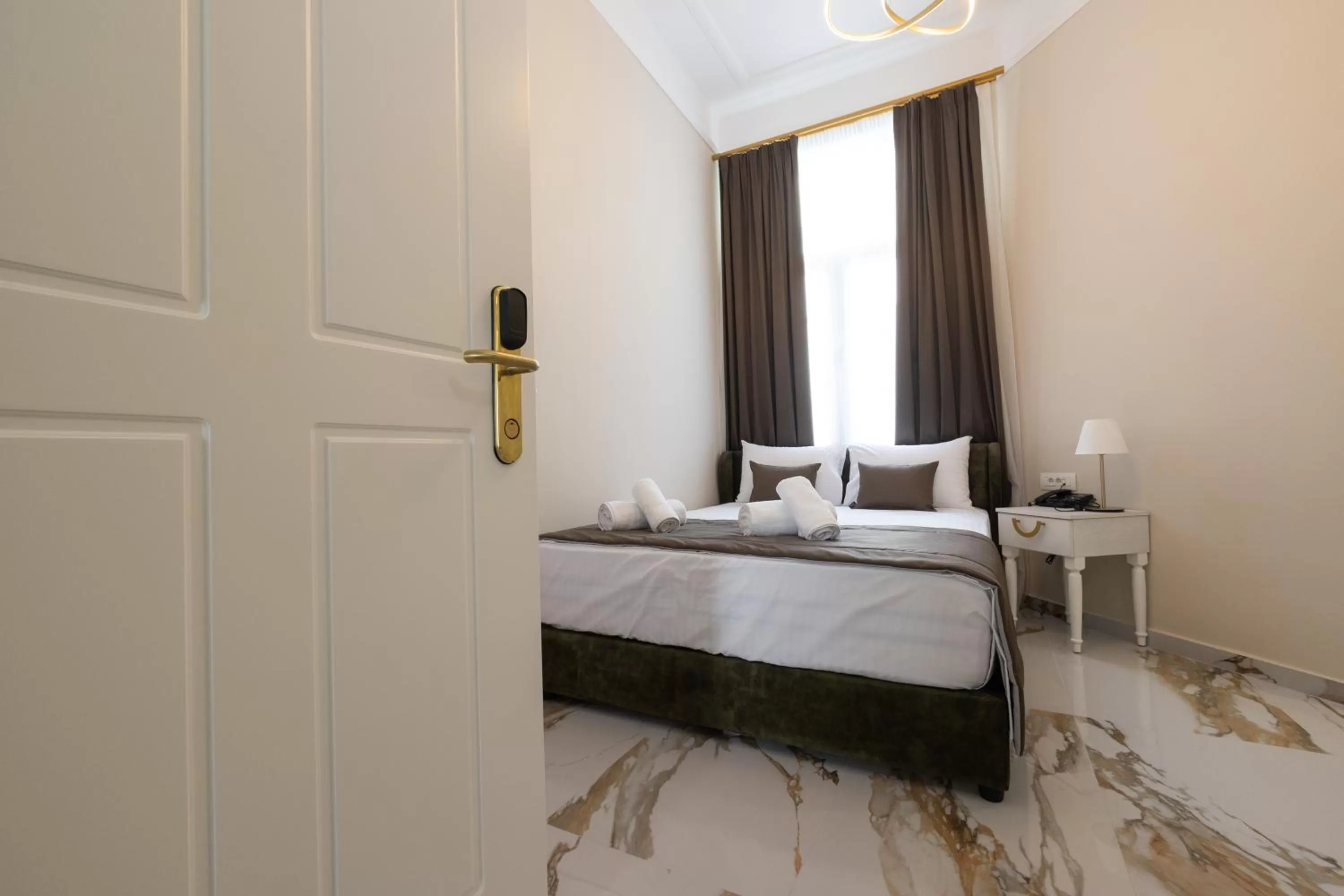 Bed in Modern Revival Luxury Hotel