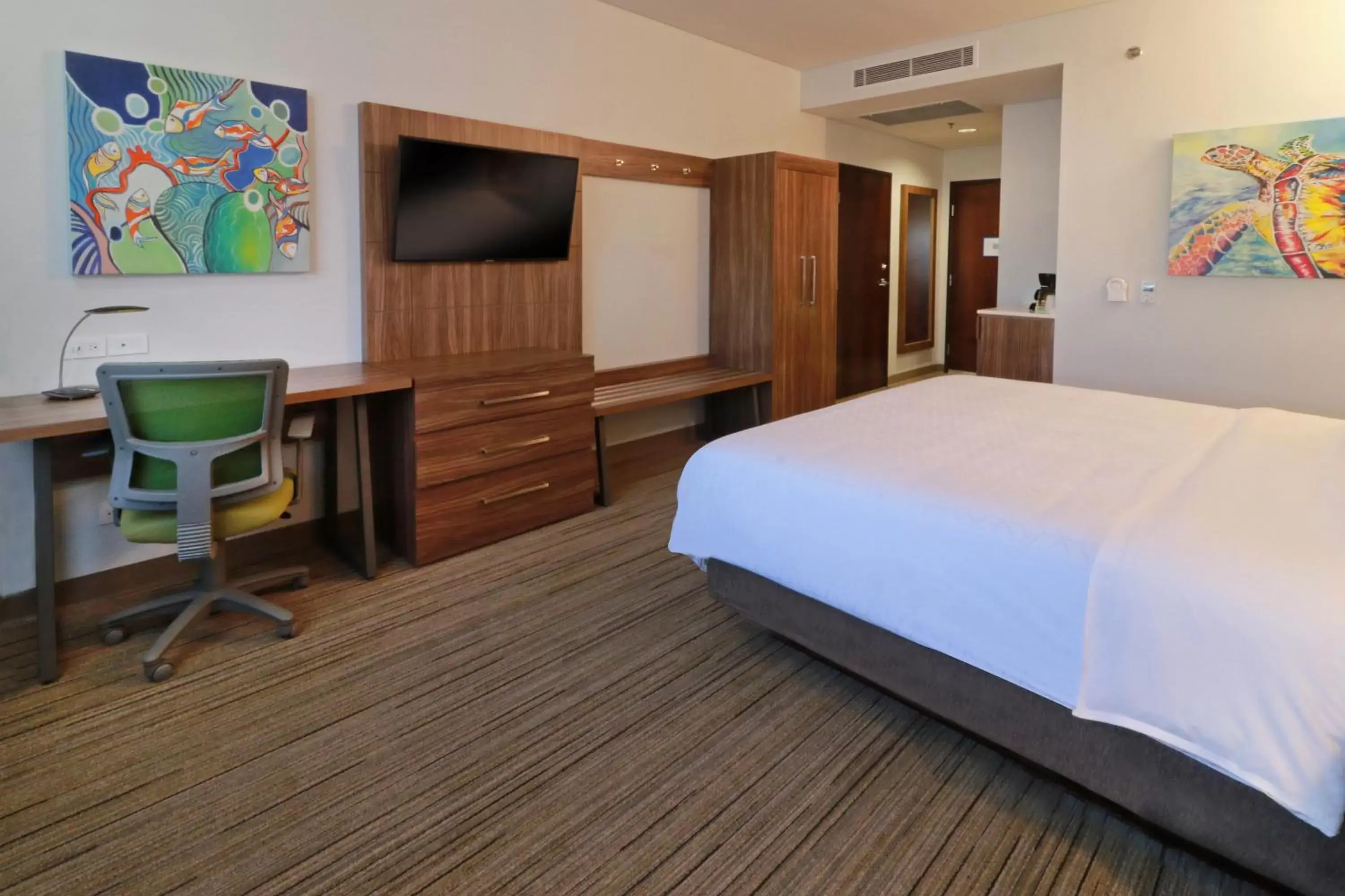 Photo of the whole room, TV/Entertainment Center in Holiday Inn Express & Suites - Ensenada Centro, an IHG Hotel