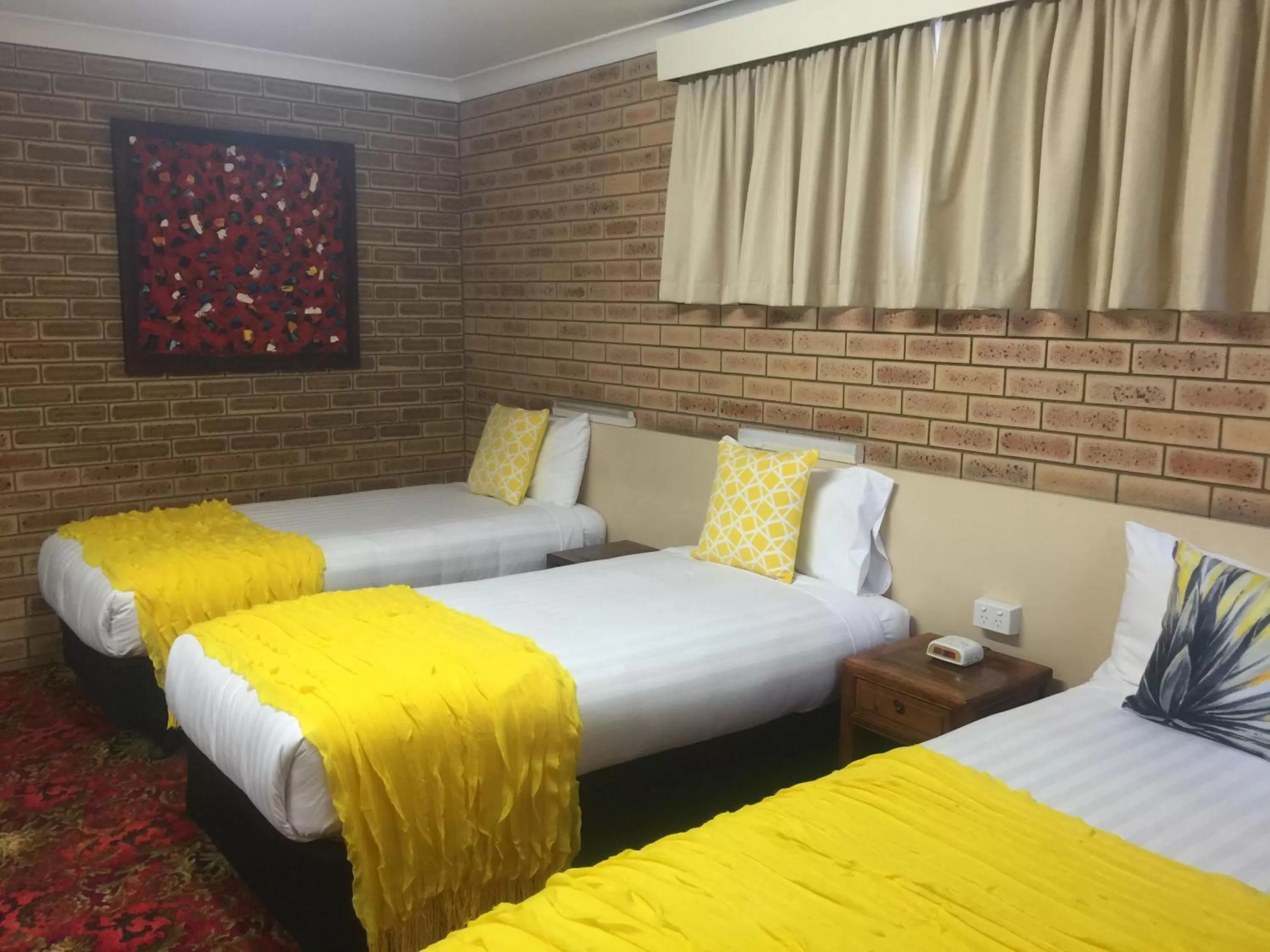 Bed in Blue Violet Motor Inn