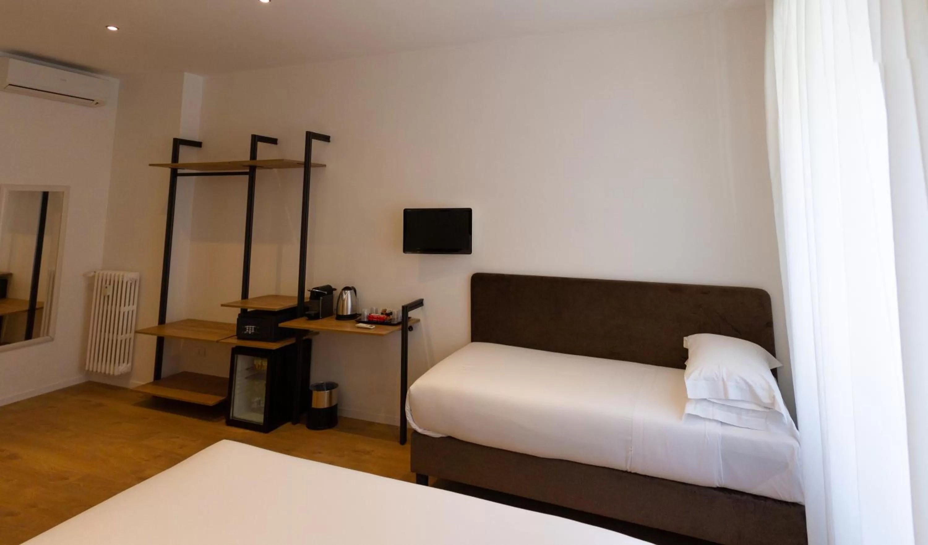 Bed in Michelangelo Vatican Rooms