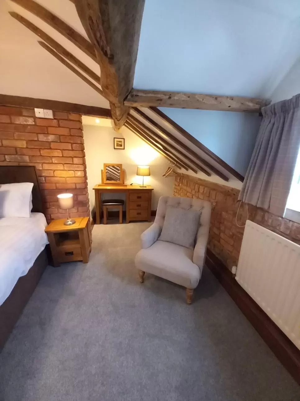 Bed in The Dolfor Inn