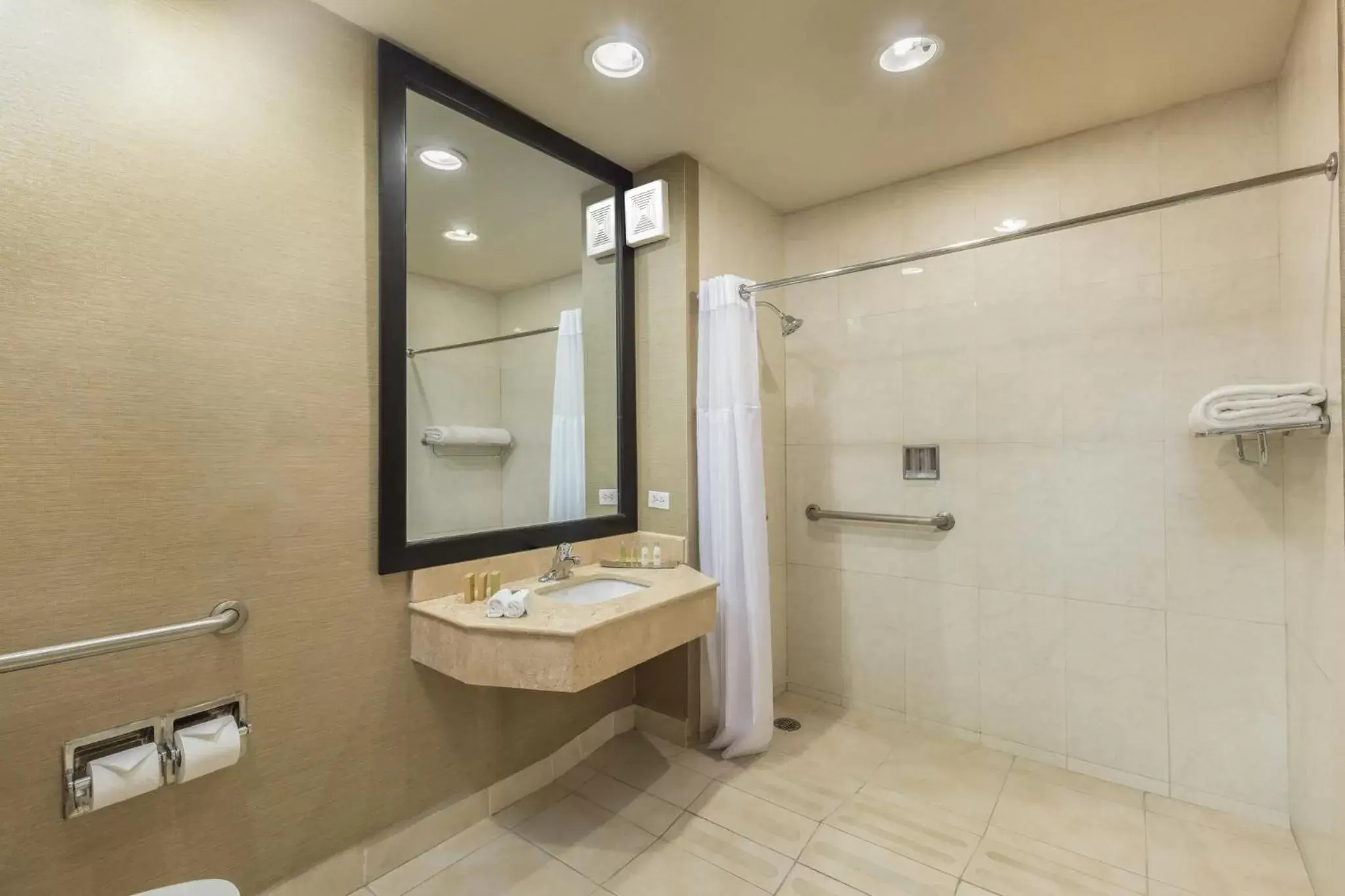 Photo of the whole room, Bathroom in CoSuites Saltillo Hotel