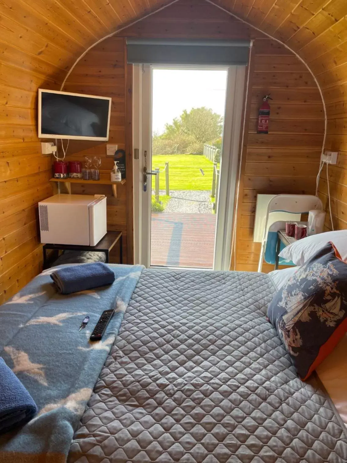 Bed in Sea and Mountain View Luxury Glamping Pods Heated