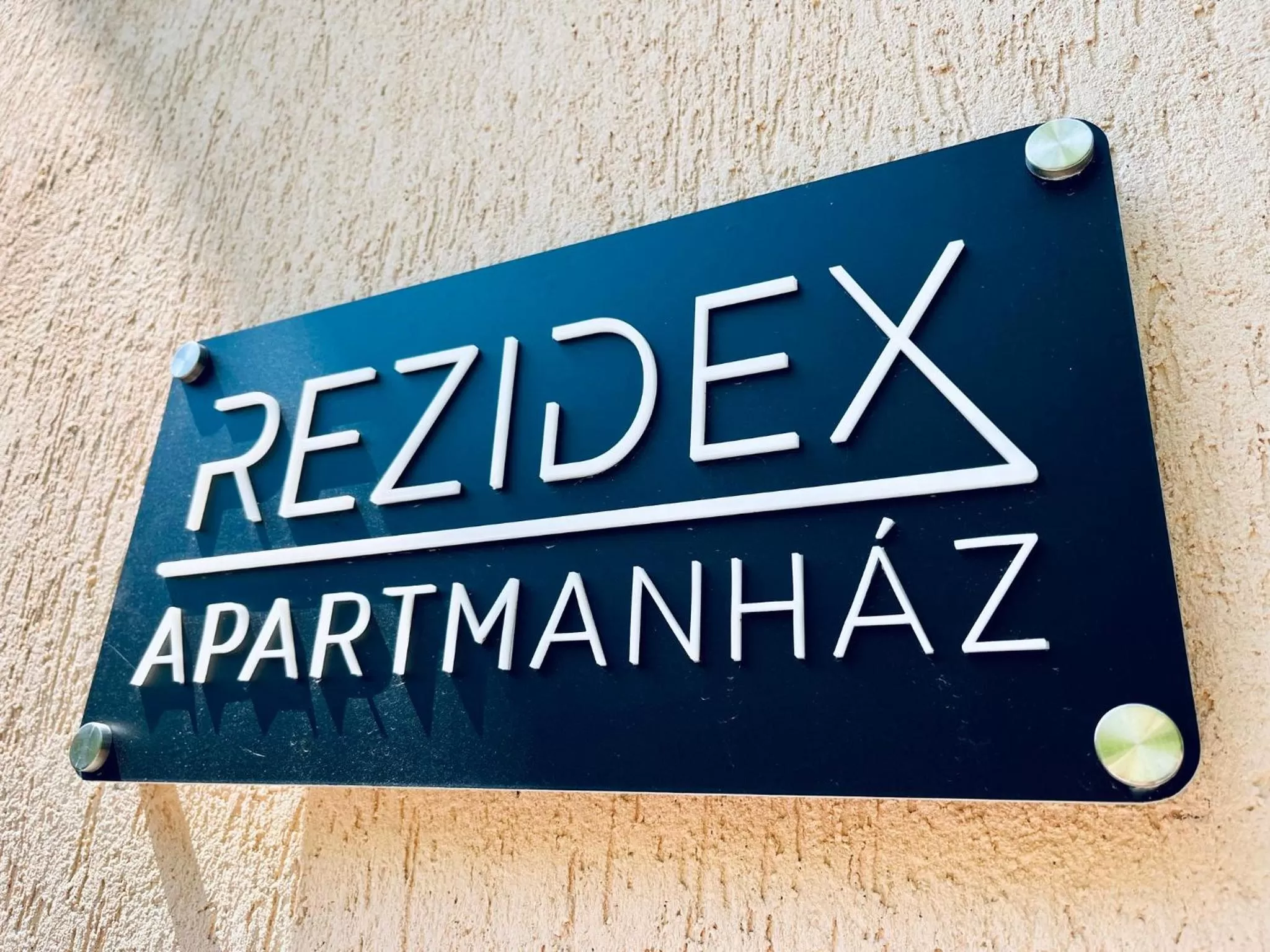 Property logo or sign in Rezidex Apartmanház