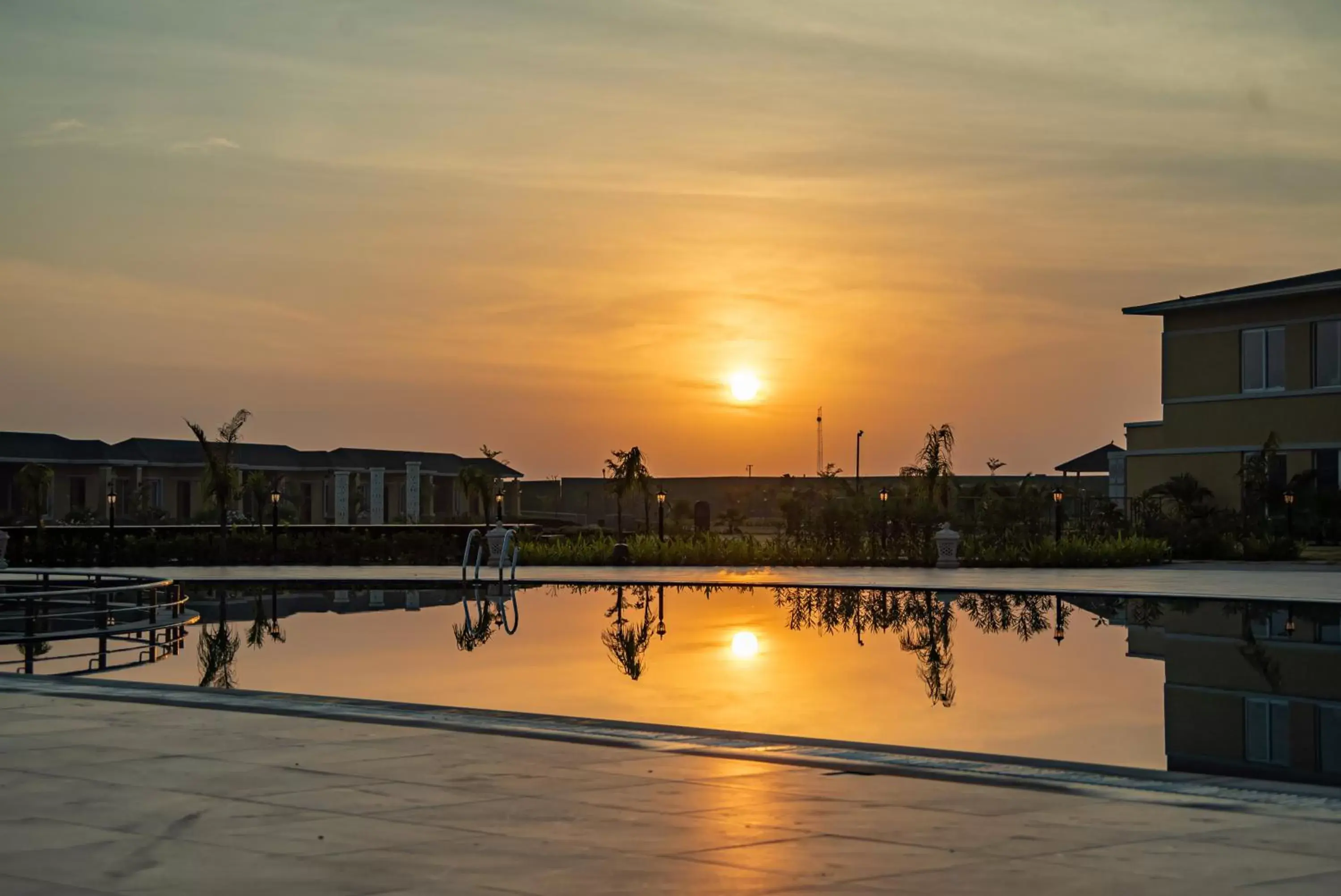 Swimming pool, Sunrise/Sunset in Hawthorn Suites by Wyndham Dwarka