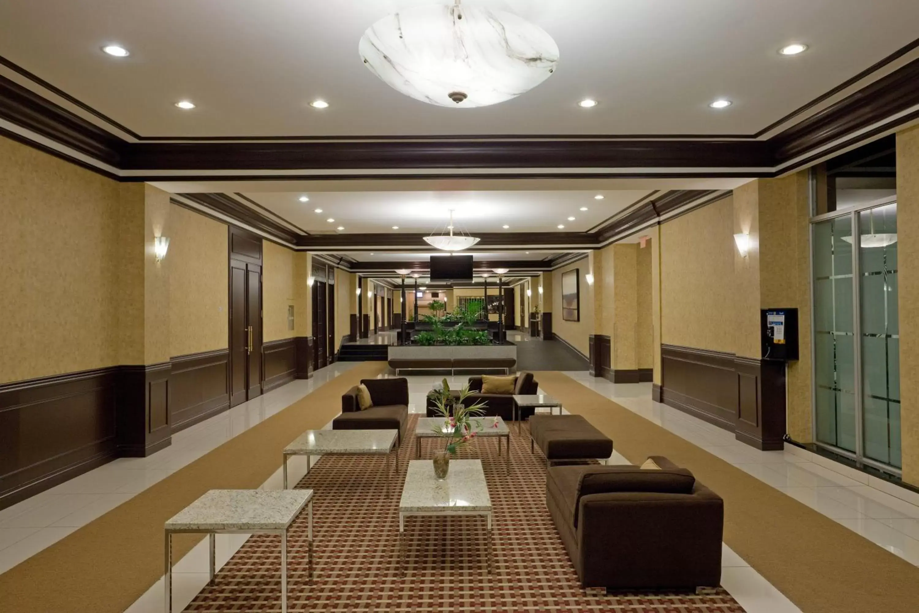 Lobby or reception in Armon Plaza Montreal Airpt, Trademark Collection by Wyndham