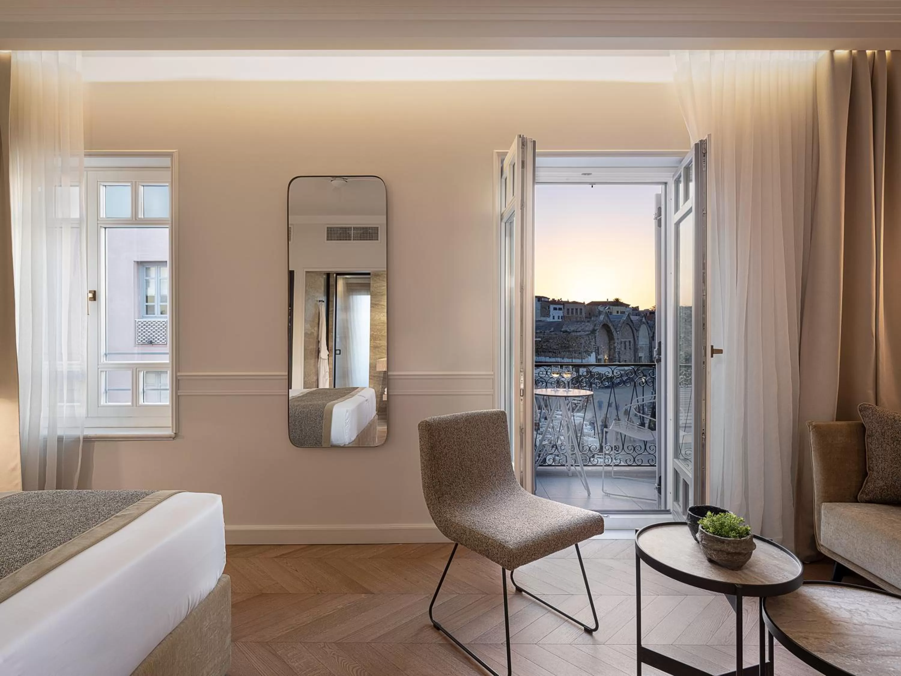 Seating area, Bed in Riviera Suites