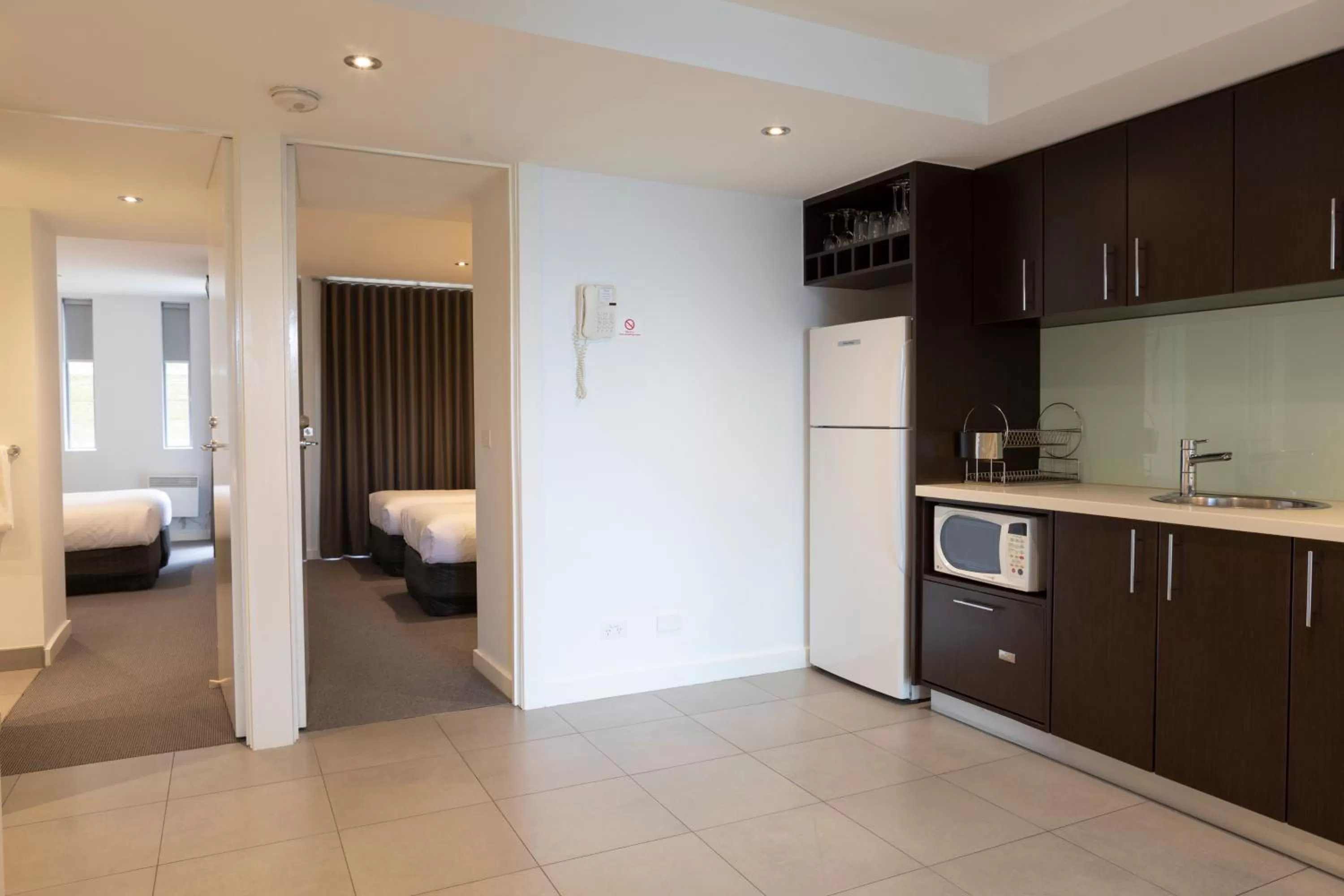 Kitchen or kitchenette, Bed in The Dolphin Apartments