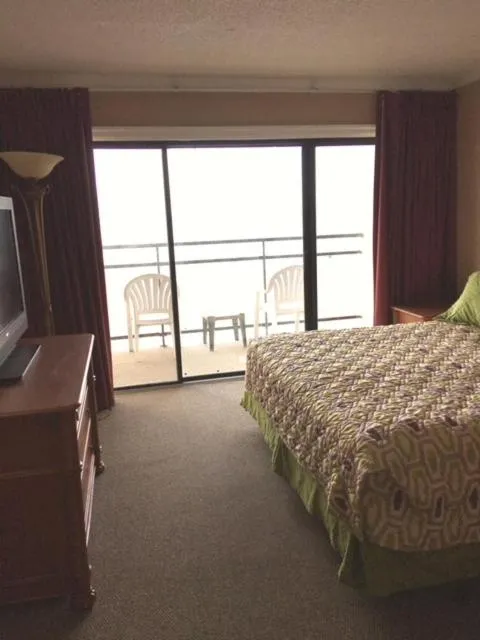 Bed in Polynesian Oceanfront Hotel