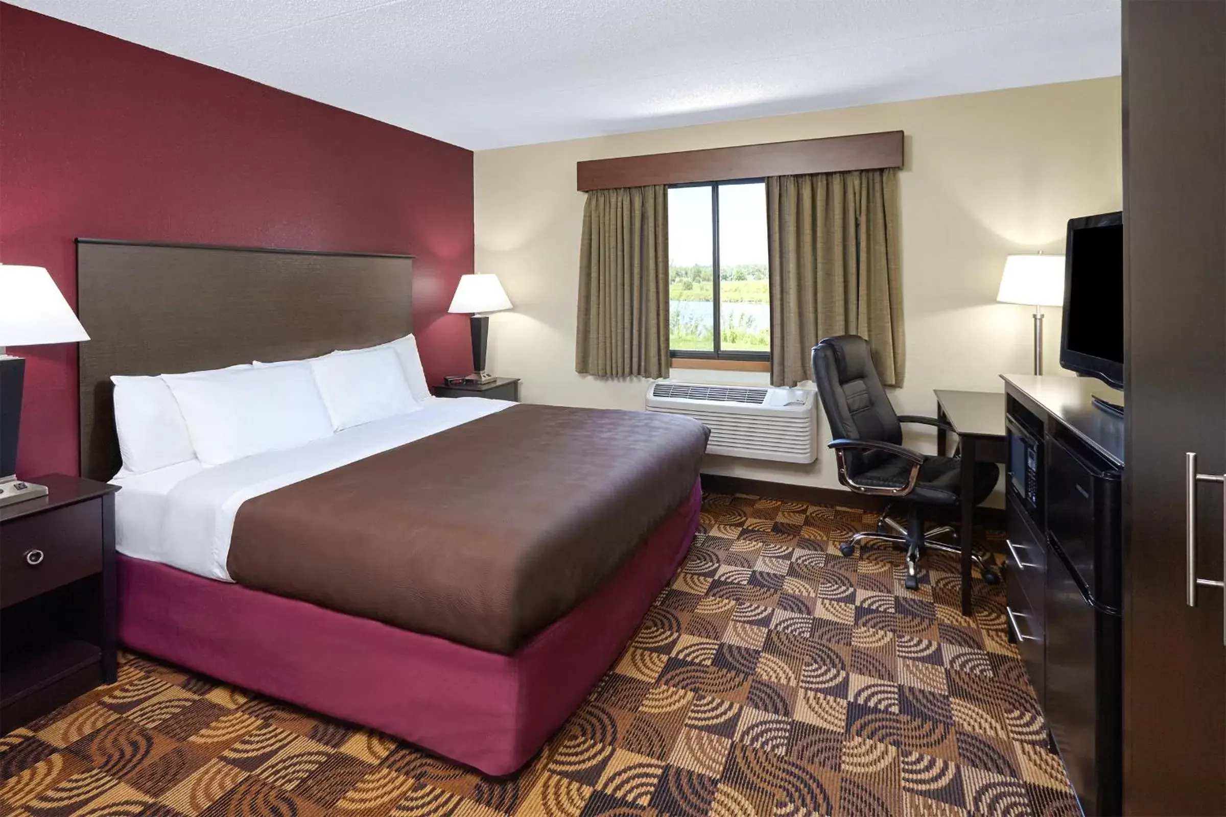 Photo of the whole room, Bed in AmericInn by Wyndham Elkhorn Near Lake Geneva