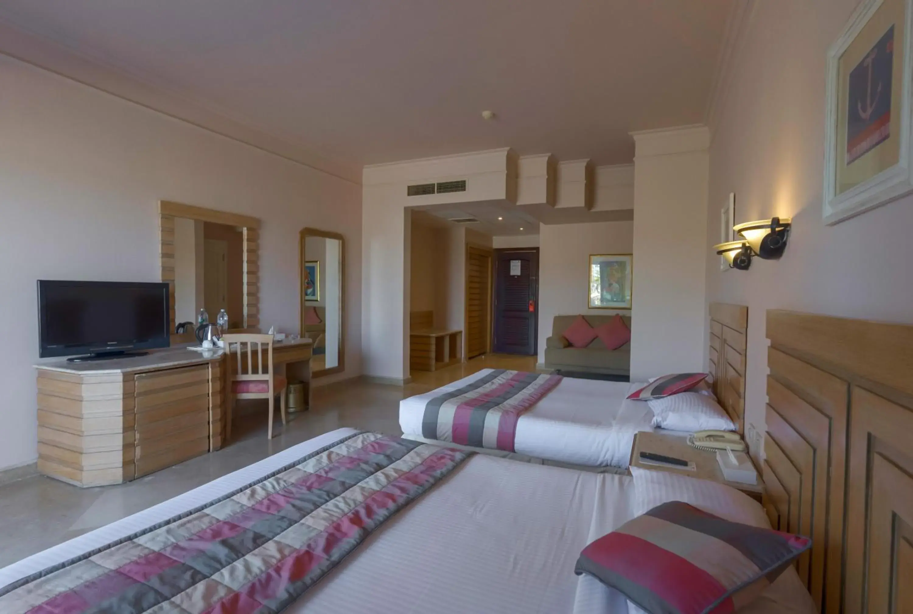Bed, TV/Entertainment Center in Hurghada Coral Beach Hotel