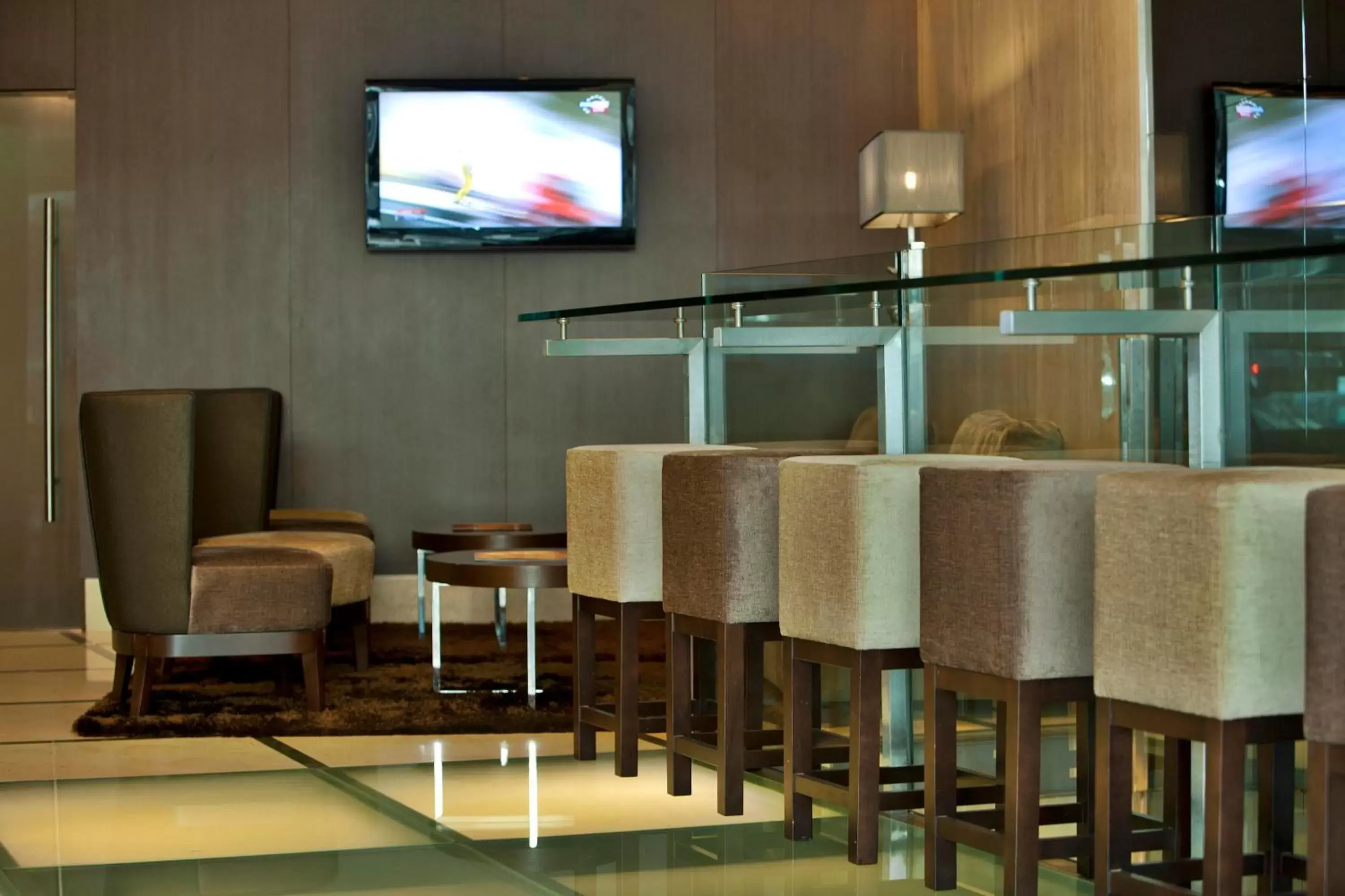 Communal lounge/ TV room in TURIM Luxe Hotel