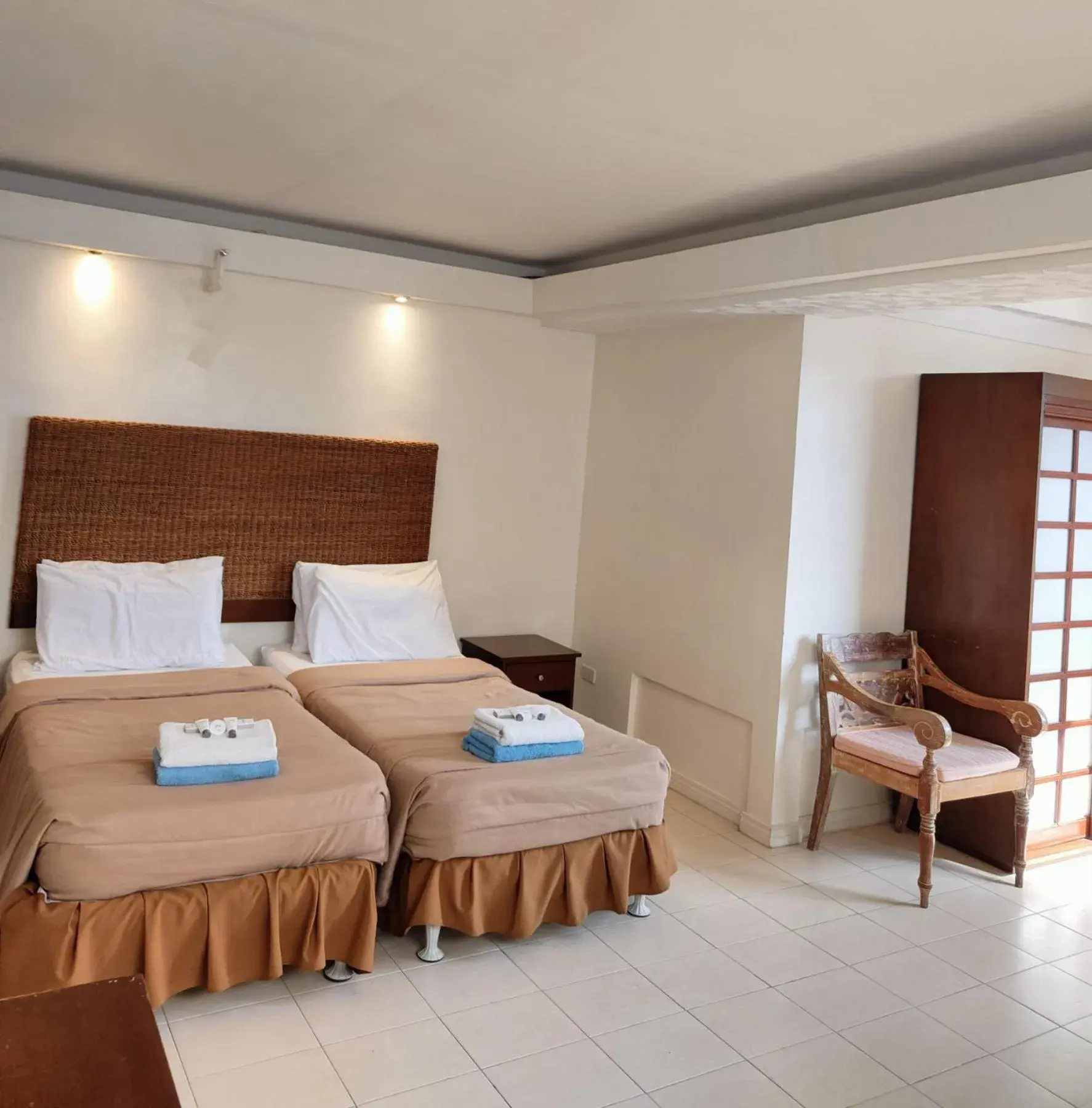 Bed in Wild Orchid Beach Resort