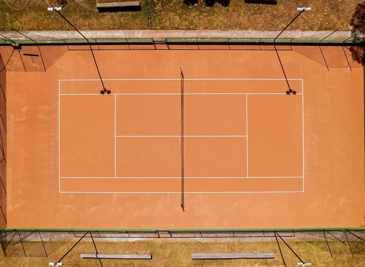 Tennis court in Hotel Resort e Golfe Clube dos 500